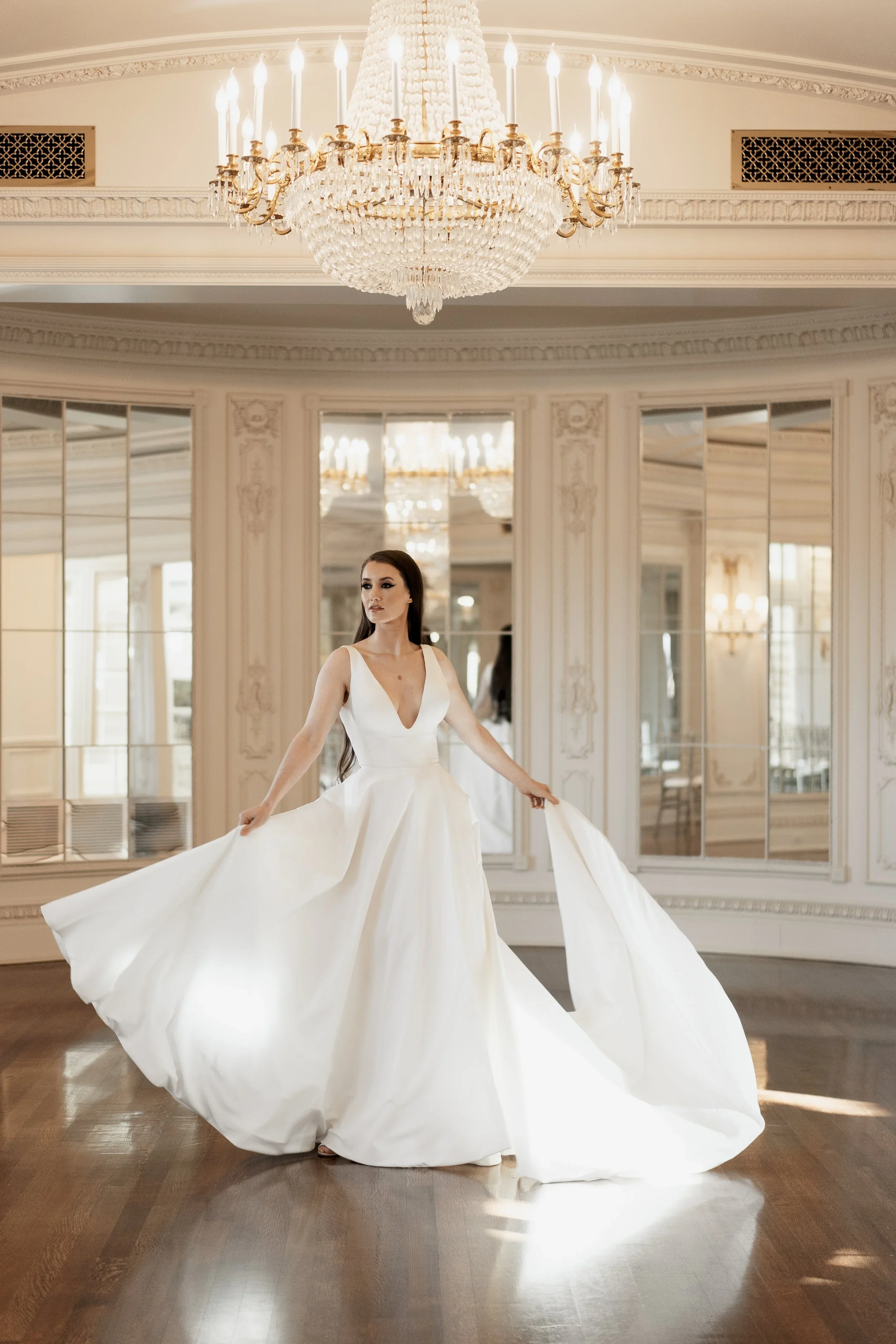 Elizabeth Lee Belle stretch crepe A-line wedding dress with scoop neckline, low square back, and hidden pleated slit.