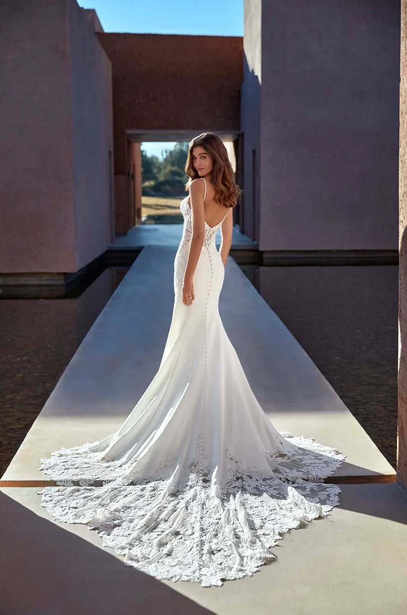 Madison James Elliotte bold wedding gown with plunging sweetheart neckline and sheer bodice with exposed boning.