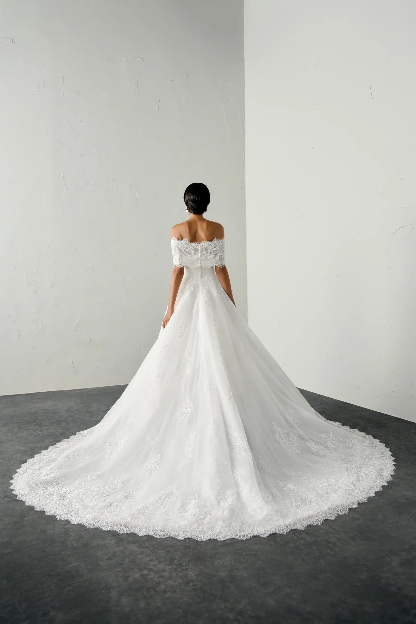 Bride wearing the Justin Alexander Signature 99391 Draven couture wedding dress with structured corset bodice and elegant bridal detailing
