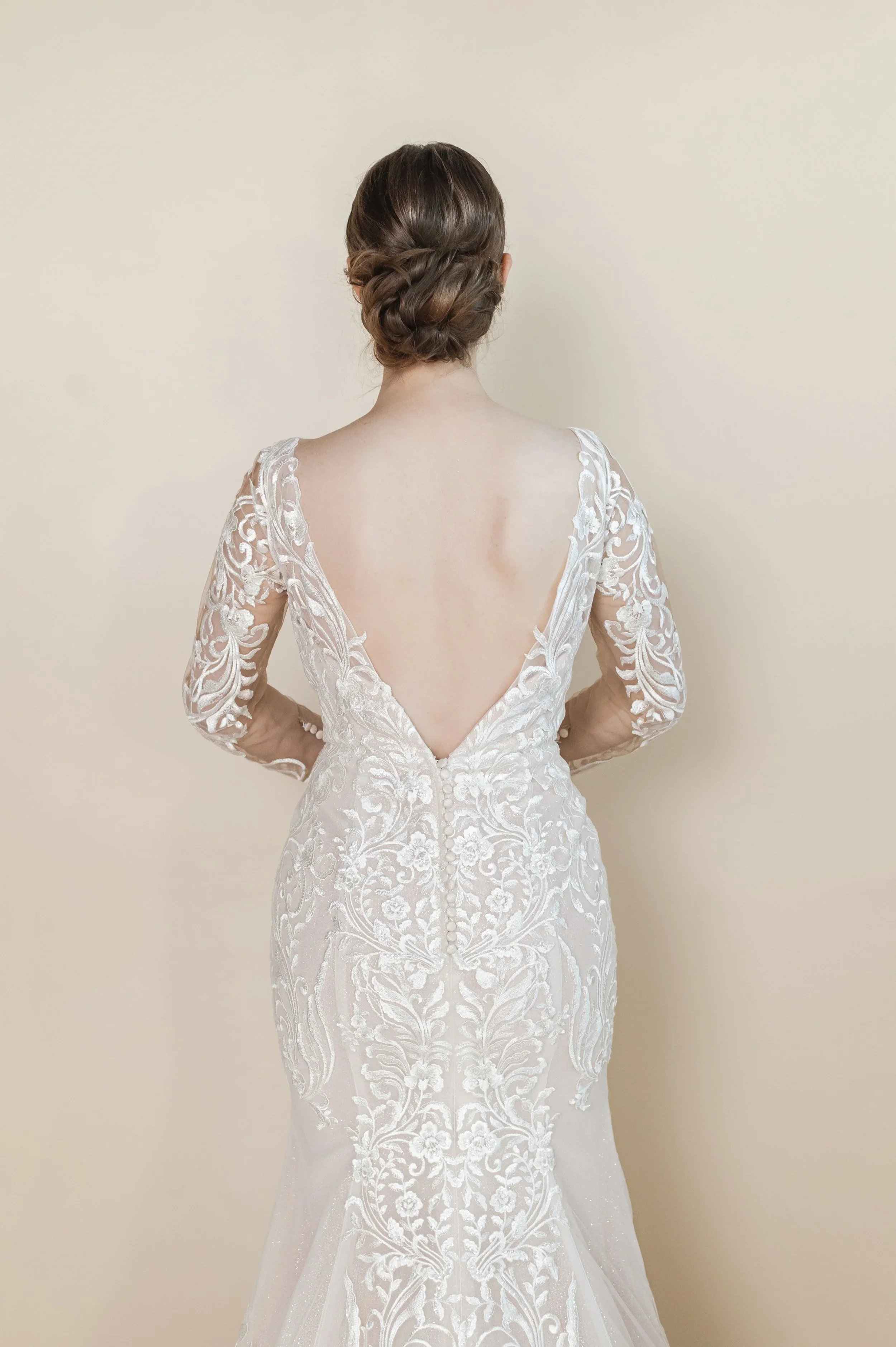 Elizabeth Lee Wendi shimmering lace mermaid wedding dress with deep plunging neckline, deep V-shaped back, and dramatic train.