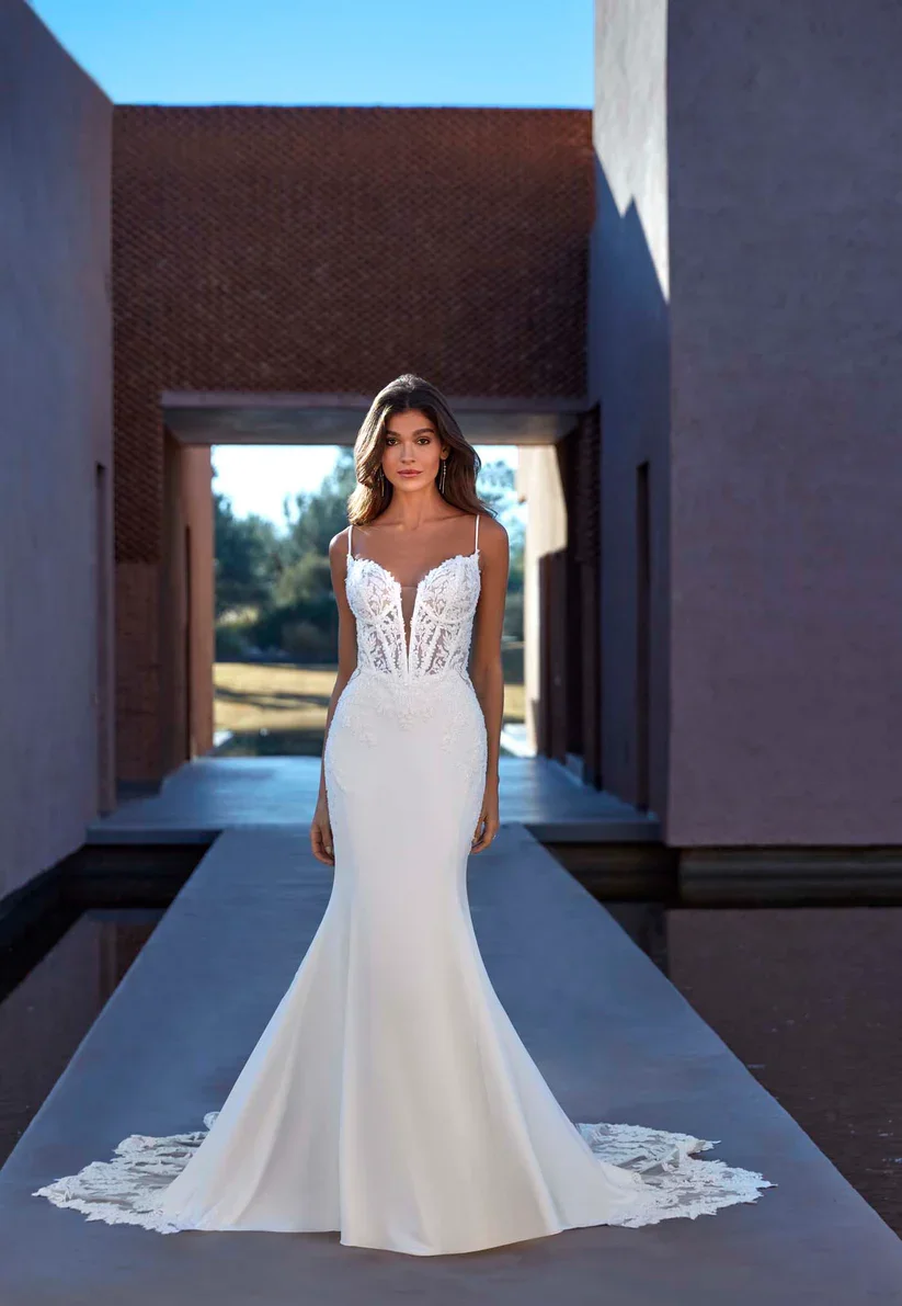 Madison James Elliotte bold wedding gown with plunging sweetheart neckline and sheer bodice with exposed boning.