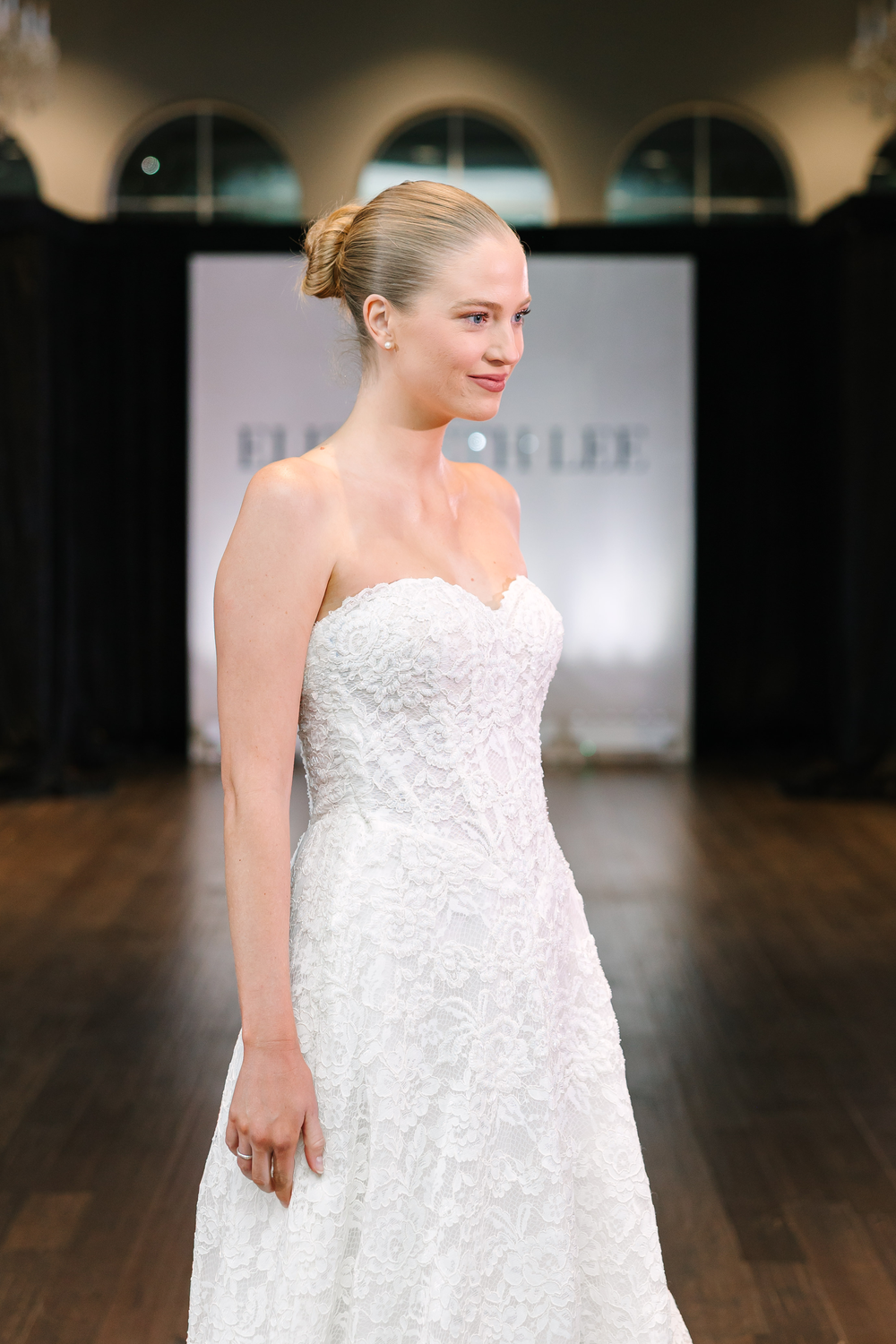 Elizabeth Lee Liliana soft A-line floral lace gown with a sweetheart neckline, basque waist, and beaded bodice, available at Bride To Be Couture in Sacramento.