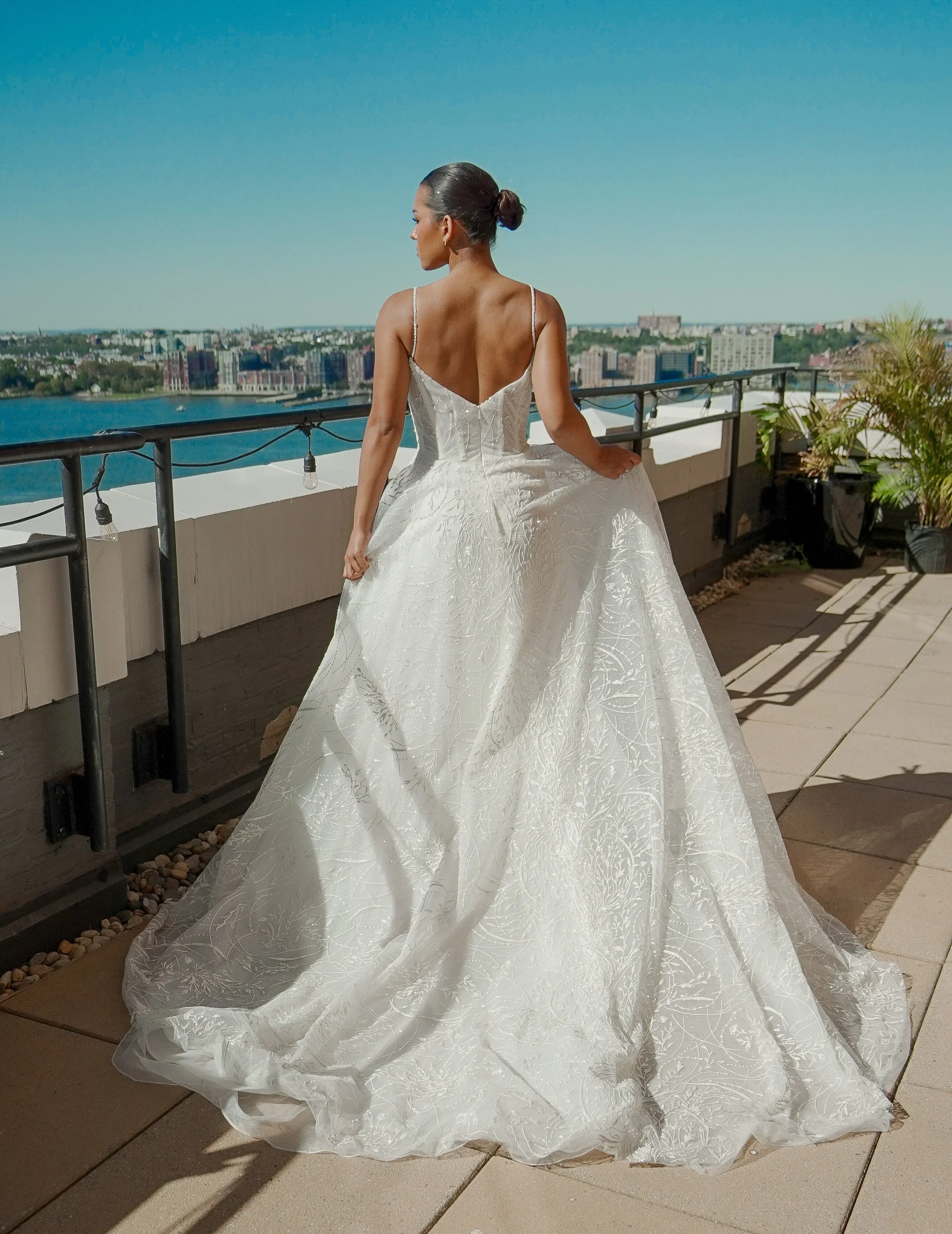 Elizabeth Lee Libby romantic A-line wedding dress with peaked sweetheart corseted bodice, beaded spaghetti straps, and embroidered tulle skirt.