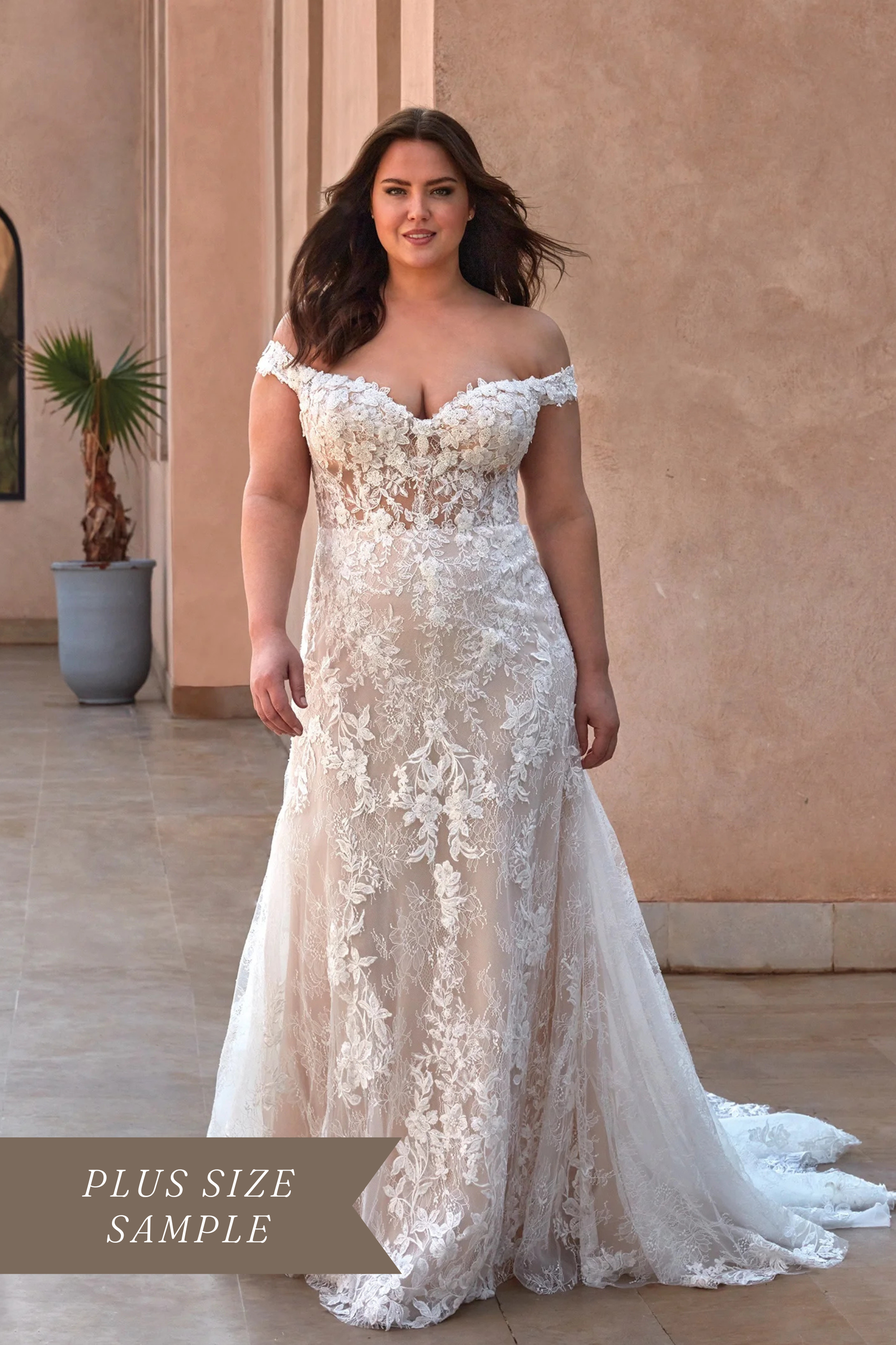Pronovias Phuket off-the-shoulder mermaid wedding dress with a sleeveless illusion bodice, intricate floral lace, and a sculptural seam back.