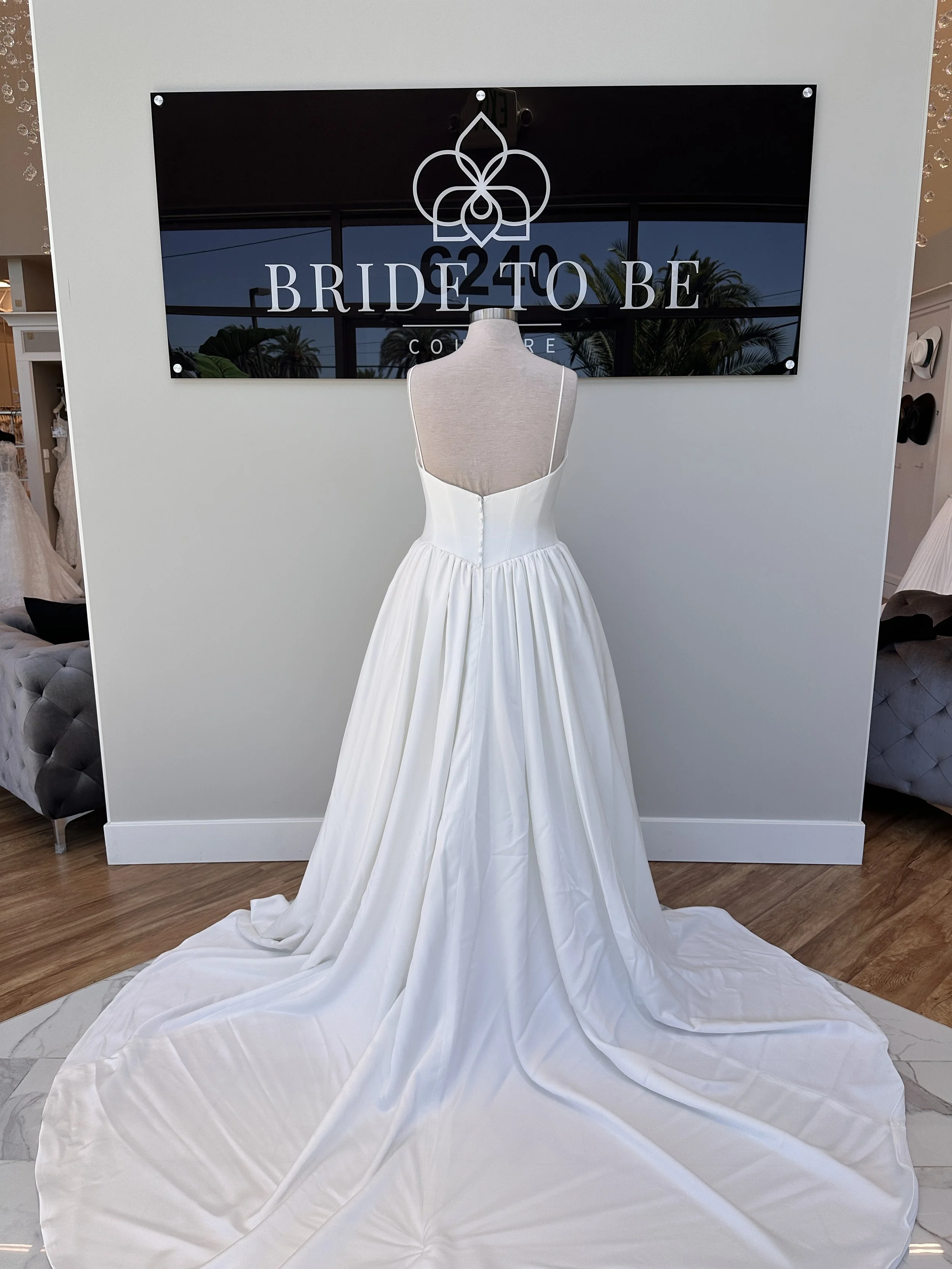 Legacy Maya satin A-line wedding dress with a V neckline at Bride To Be Couture Sacramento.