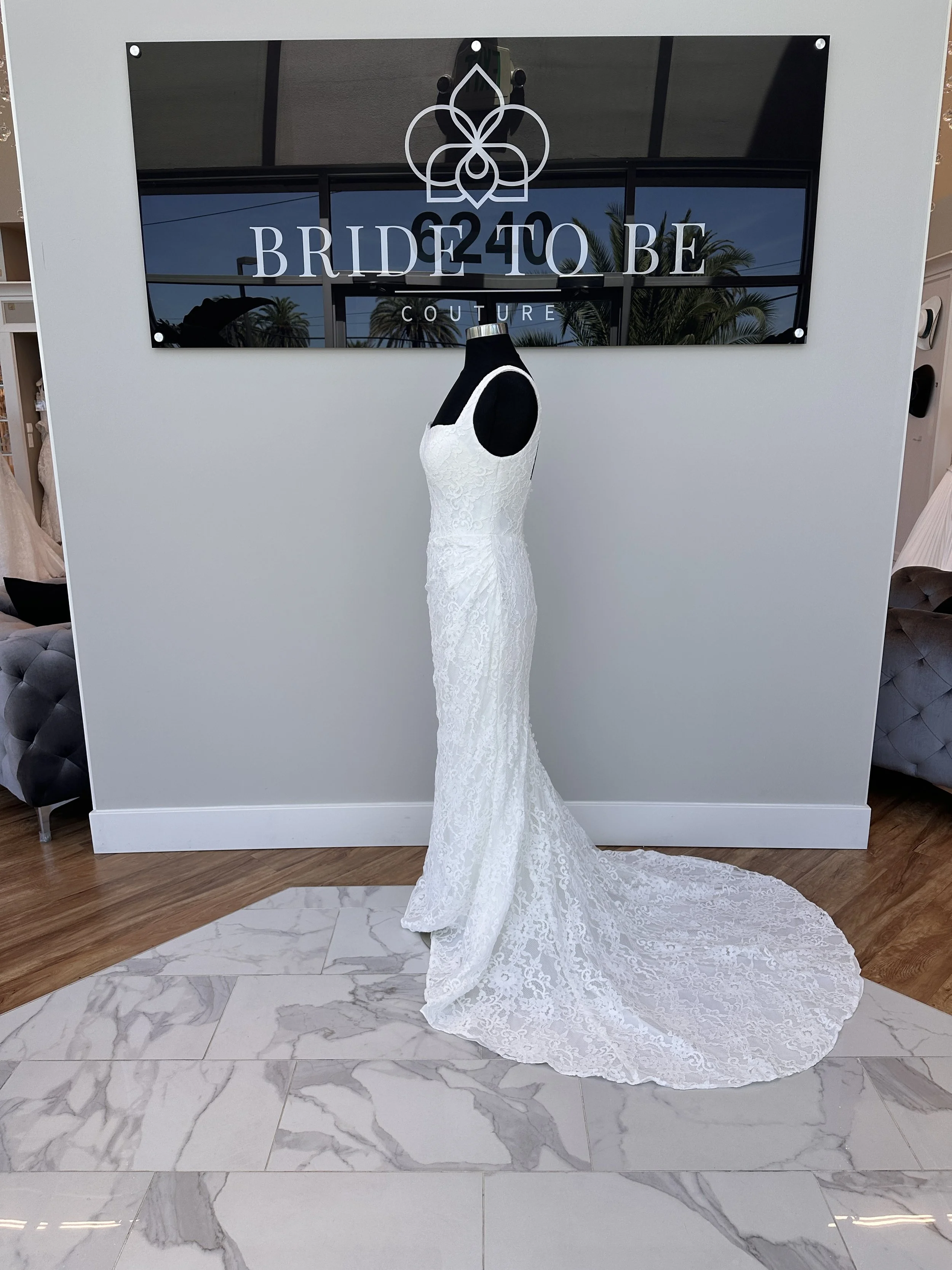 Legacy Jane lace fit-and-flare wedding dress with a square neckline at Bride To Be Couture Sacramento.