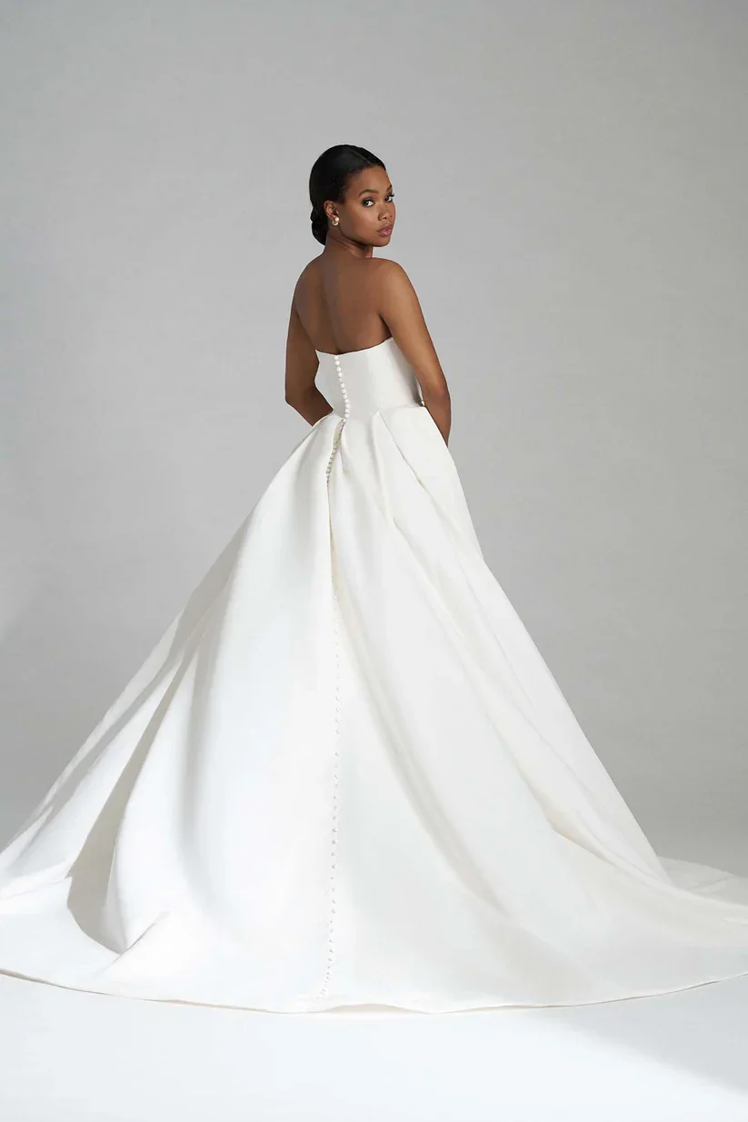 Madison James Larissa classic A-line wedding gown with statuesque strapless sweetheart bodice and dramatic front slit.