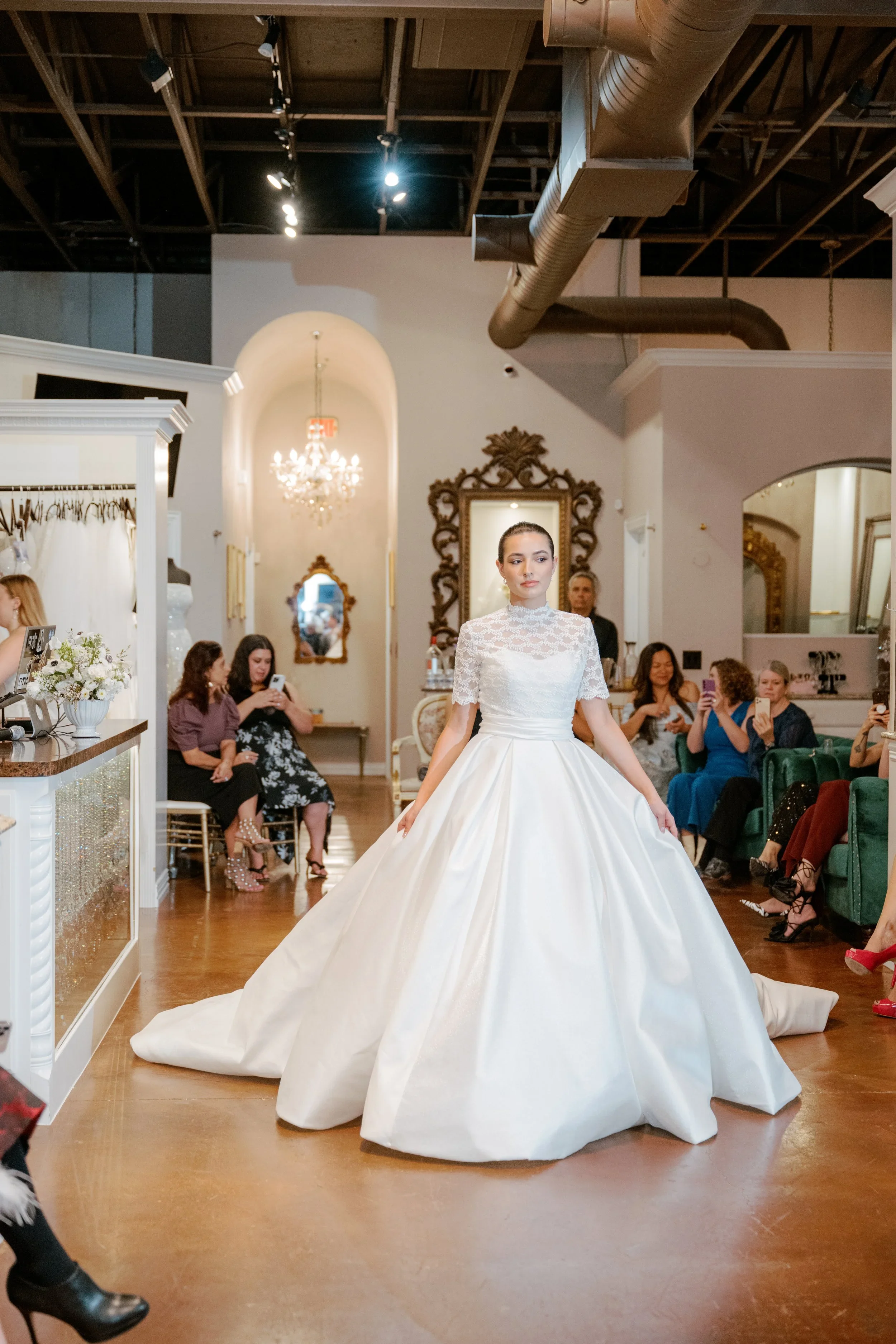 Elizabeth Lee Sylvie vintage-inspired ballgown wedding dress with illusion lace bodice, high mandarin collar, short lace sleeves, and pleated satin skirt.