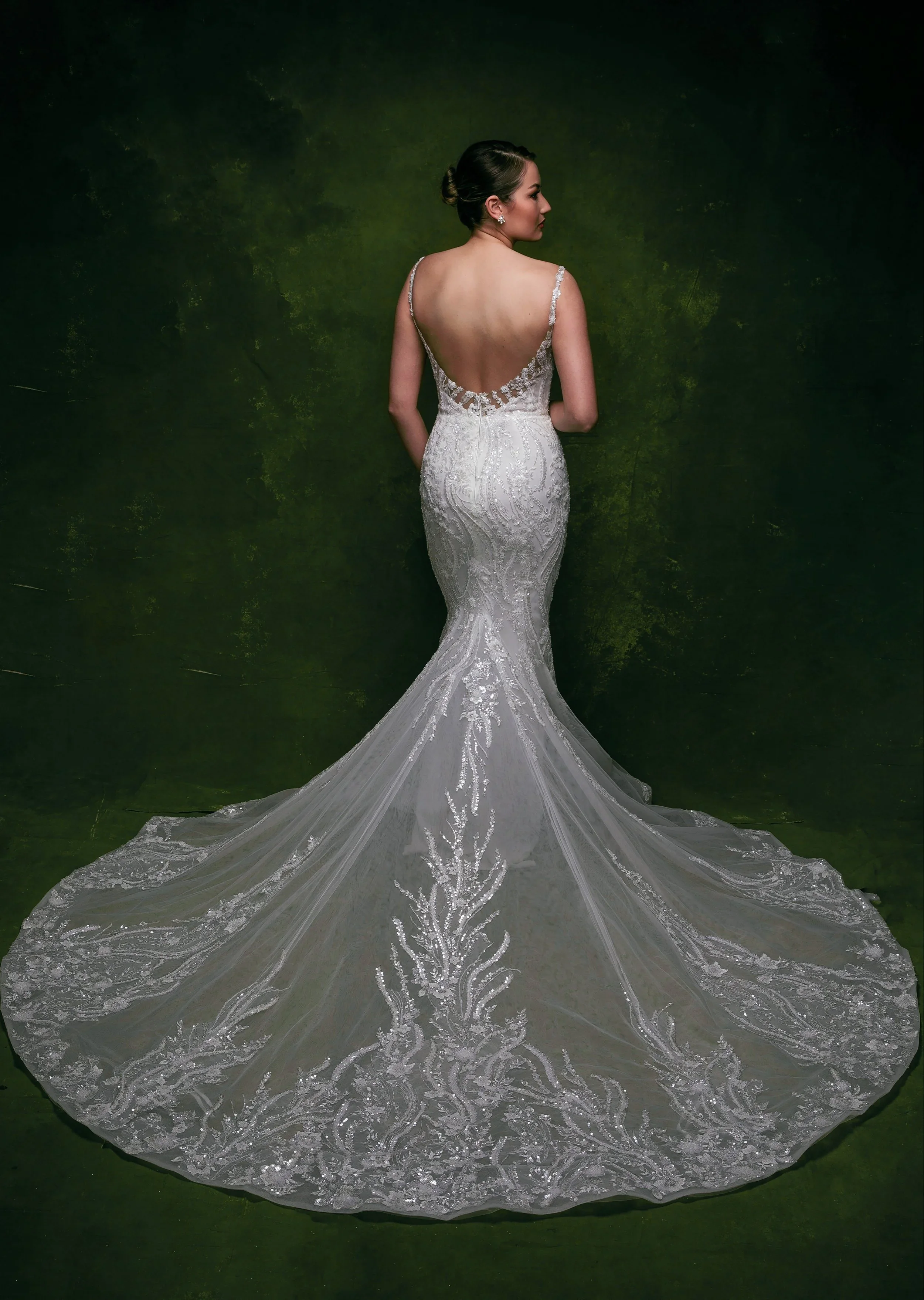 Elizabeth Lee Becca intricate beaded lace wedding dress with low scoop back and shimmering beaded details throughout.