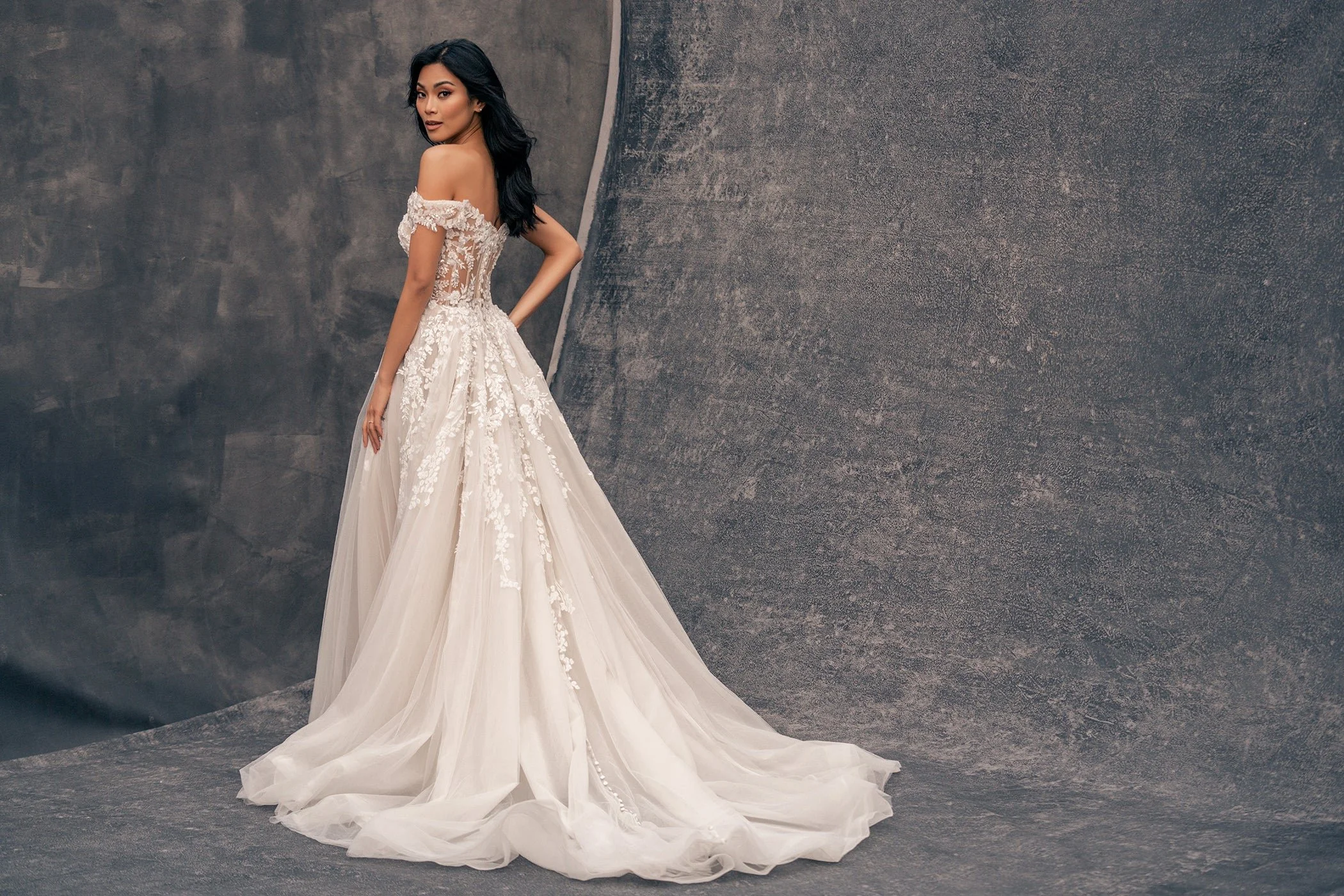 Allure Couture C705 A-line gown with off-shoulder straps, floral lace bodice and flowing tulle slit skirt - Side View