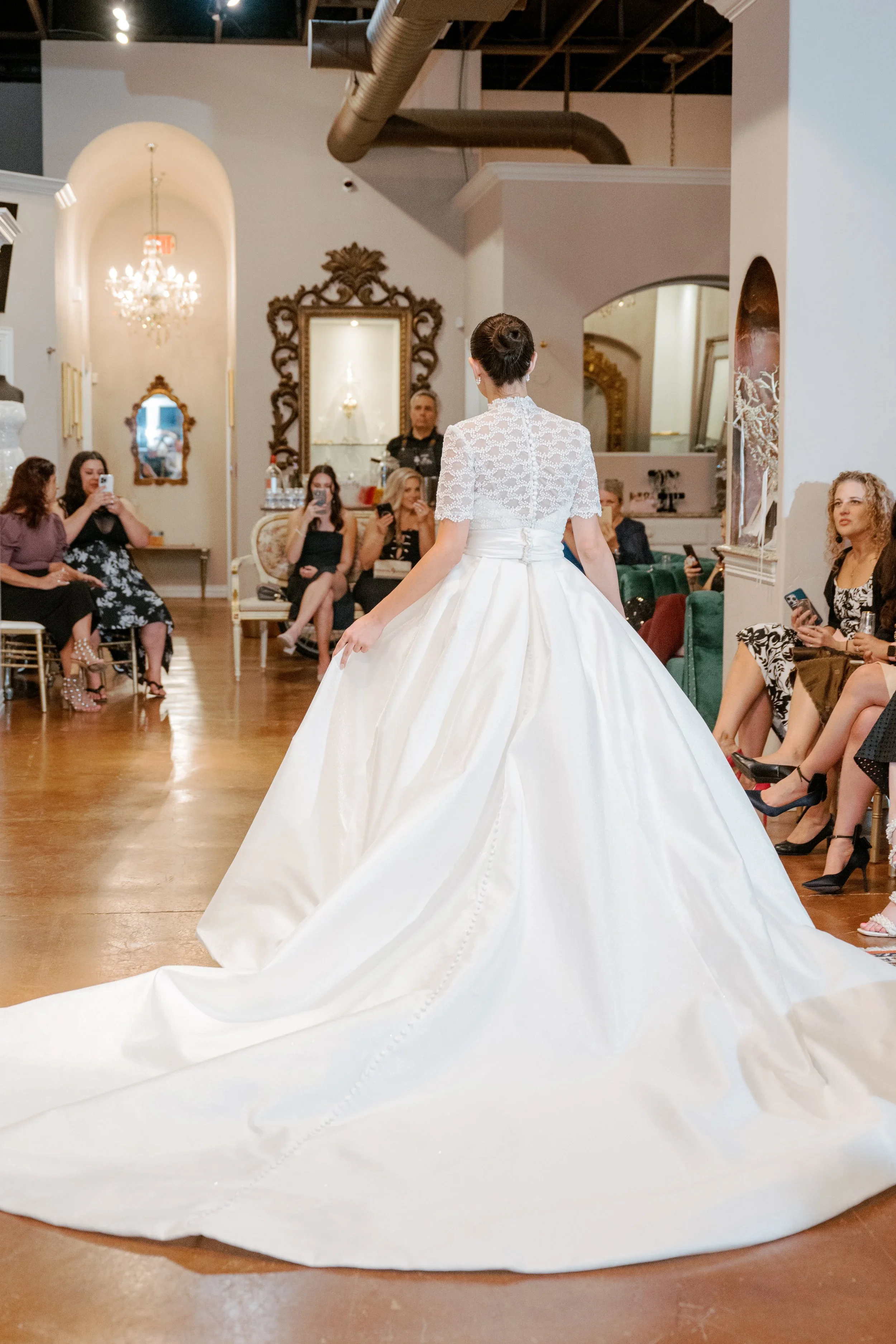 Elizabeth Lee Sylvie vintage-inspired ballgown wedding dress with illusion lace bodice, high mandarin collar, short lace sleeves, and pleated satin skirt.