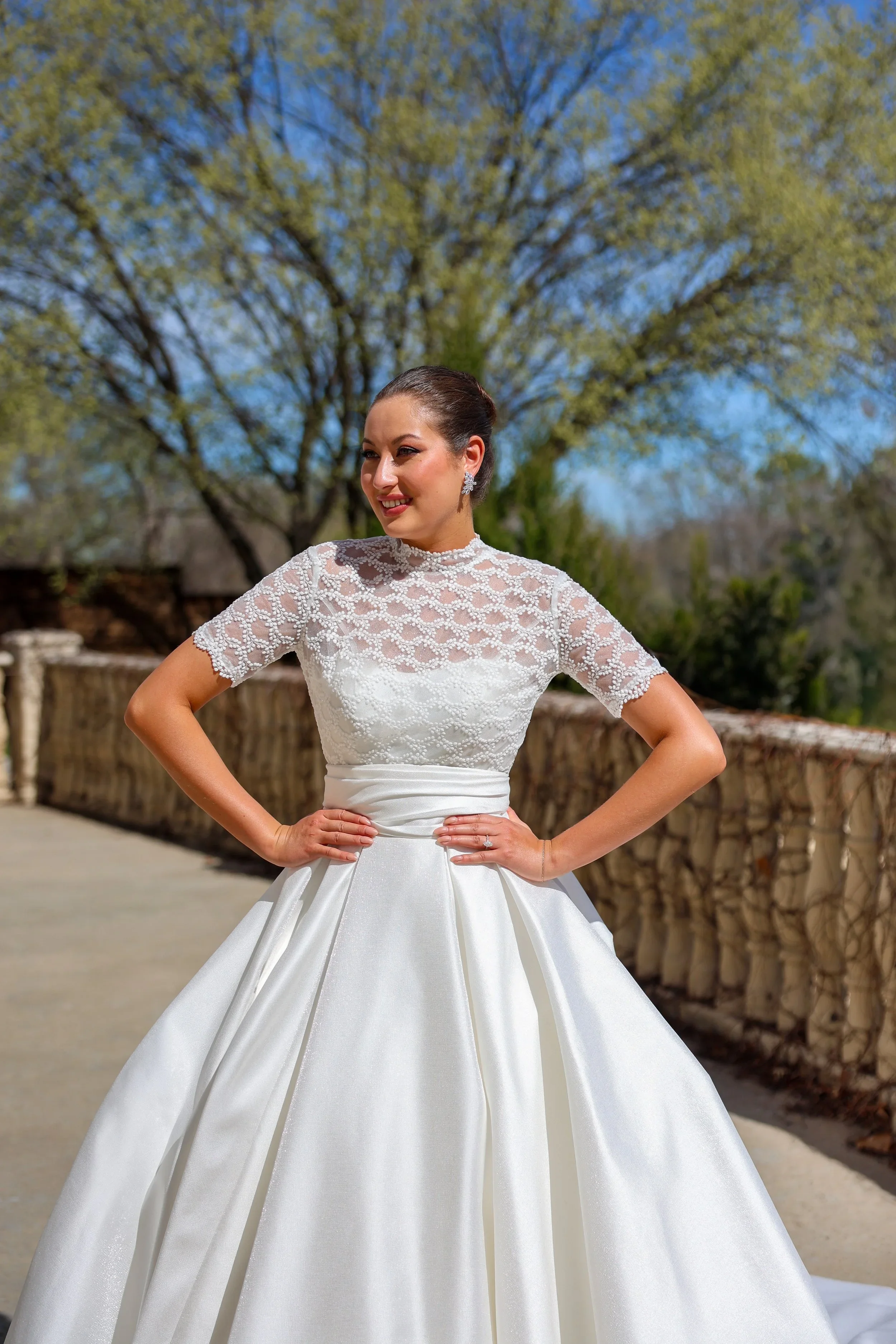 Elizabeth Lee Sylvie vintage-inspired ballgown wedding dress with illusion lace bodice, high mandarin collar, short lace sleeves, and pleated satin skirt.