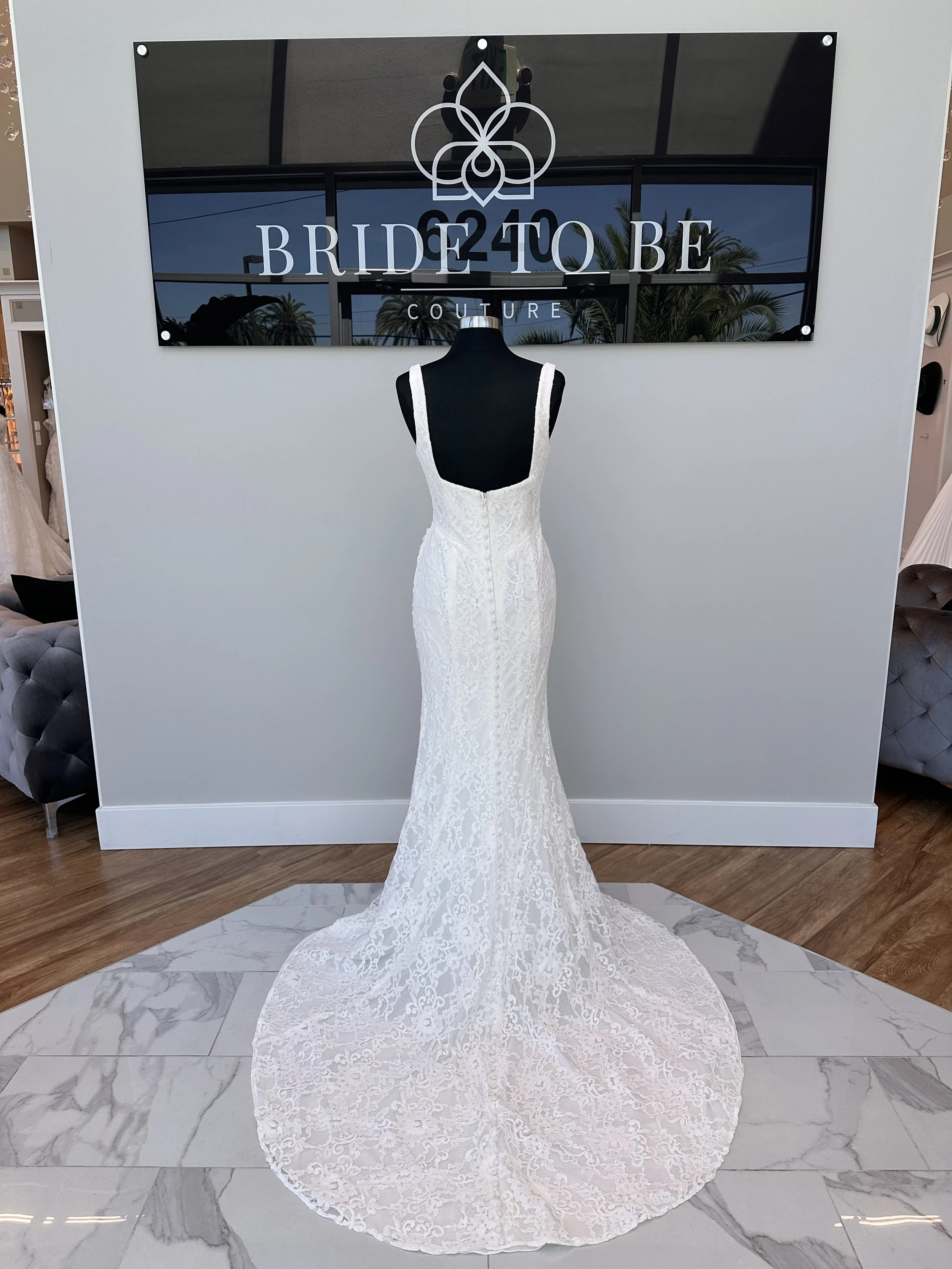 Legacy Jane lace fit-and-flare wedding dress with a square neckline at Bride To Be Couture Sacramento.