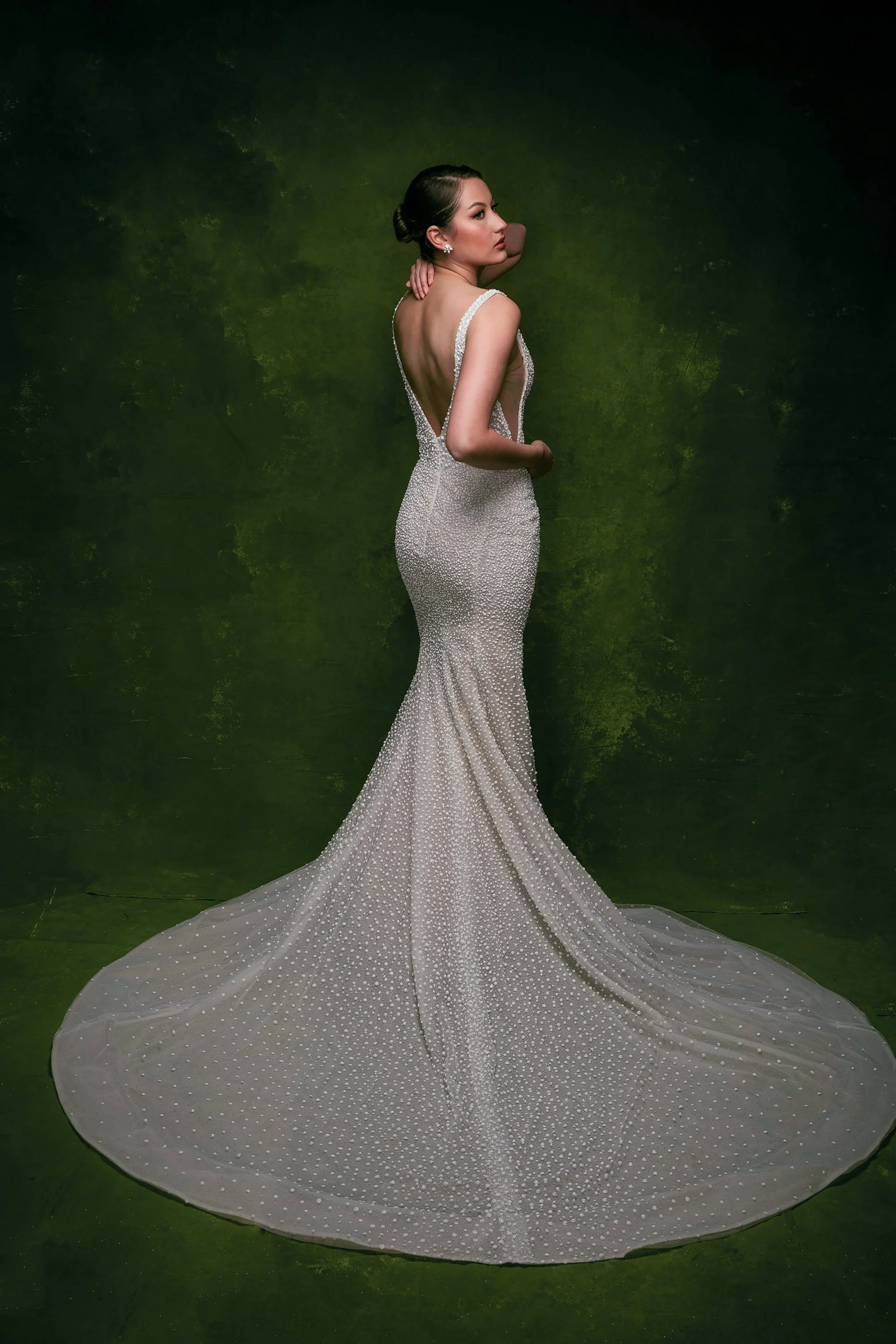 Elizabeth Lee Halo 3D dotted sparkle fit-and-flare wedding dress with deep plunge neckline and side mesh cutouts.