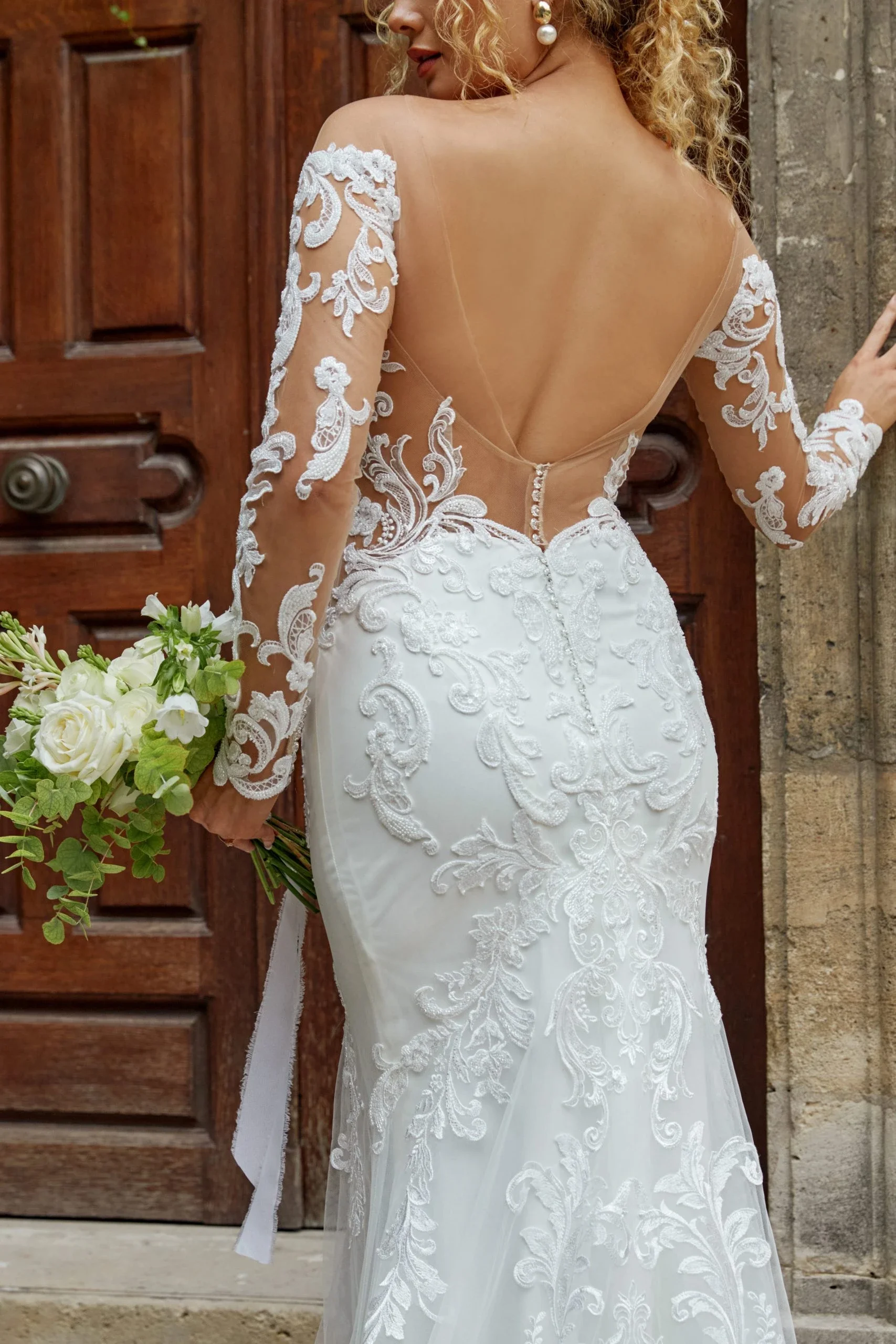 Alluring Long Sleeve Lace Fit and Flare Wedding Dress with Open Back Detail