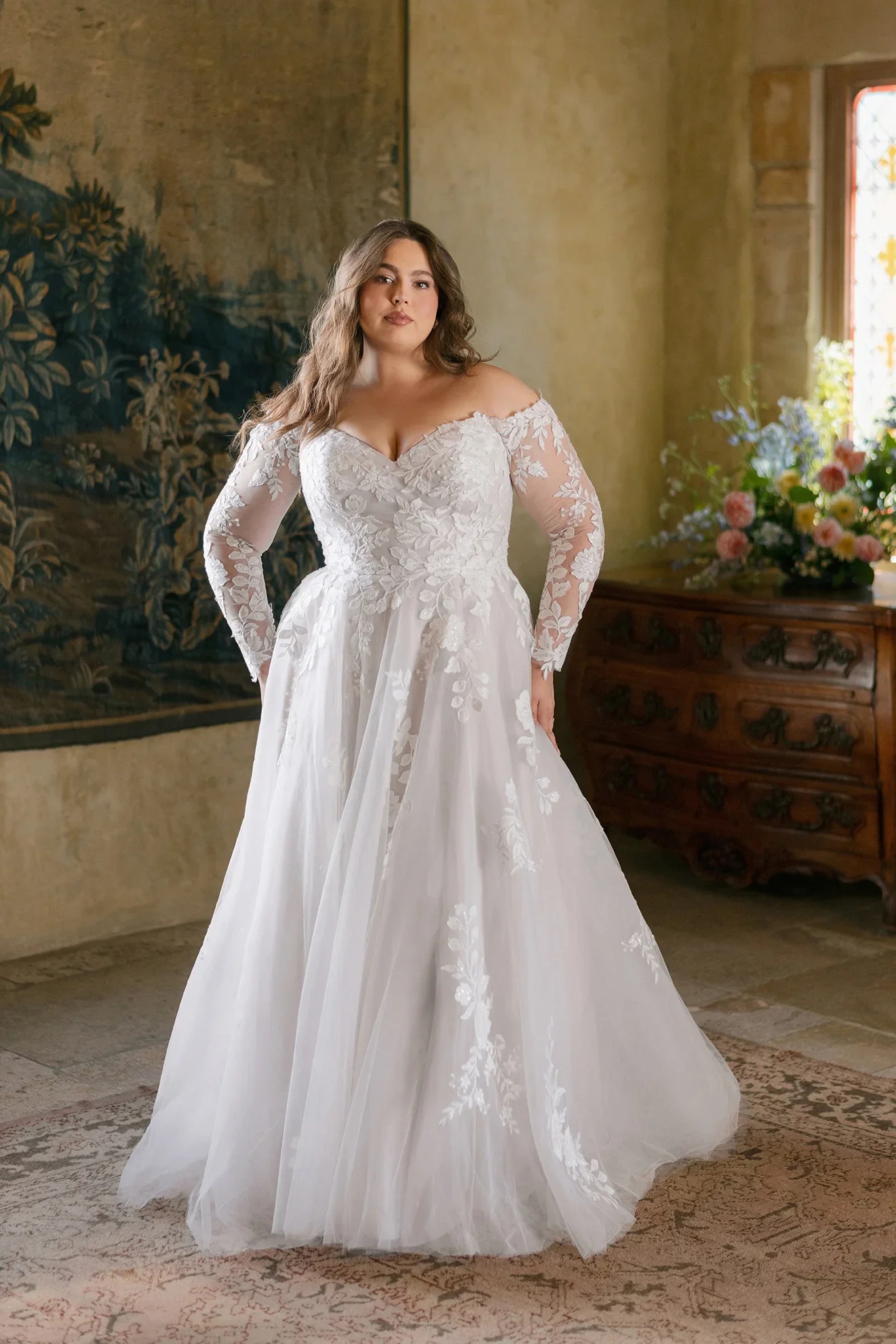 plus size romantic tulle ballgown wedding dress with sweetheart neckline, sheer off-the-shoulder long sleeves, and delicate lace appliques