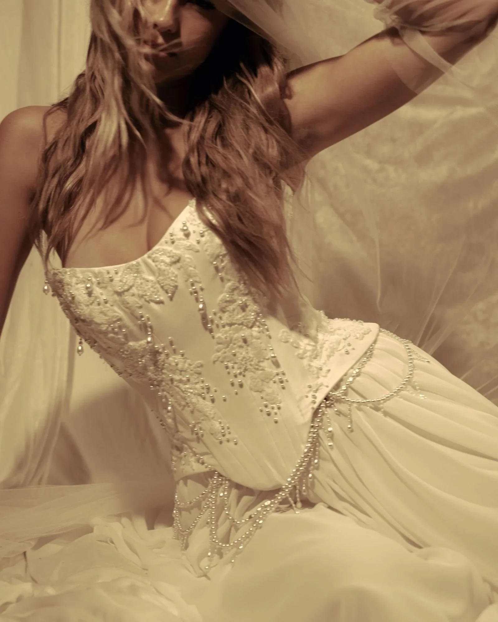 Molded taffeta corset bodice with strapless scoop neckline, draped pearl and delicate embroidery detail