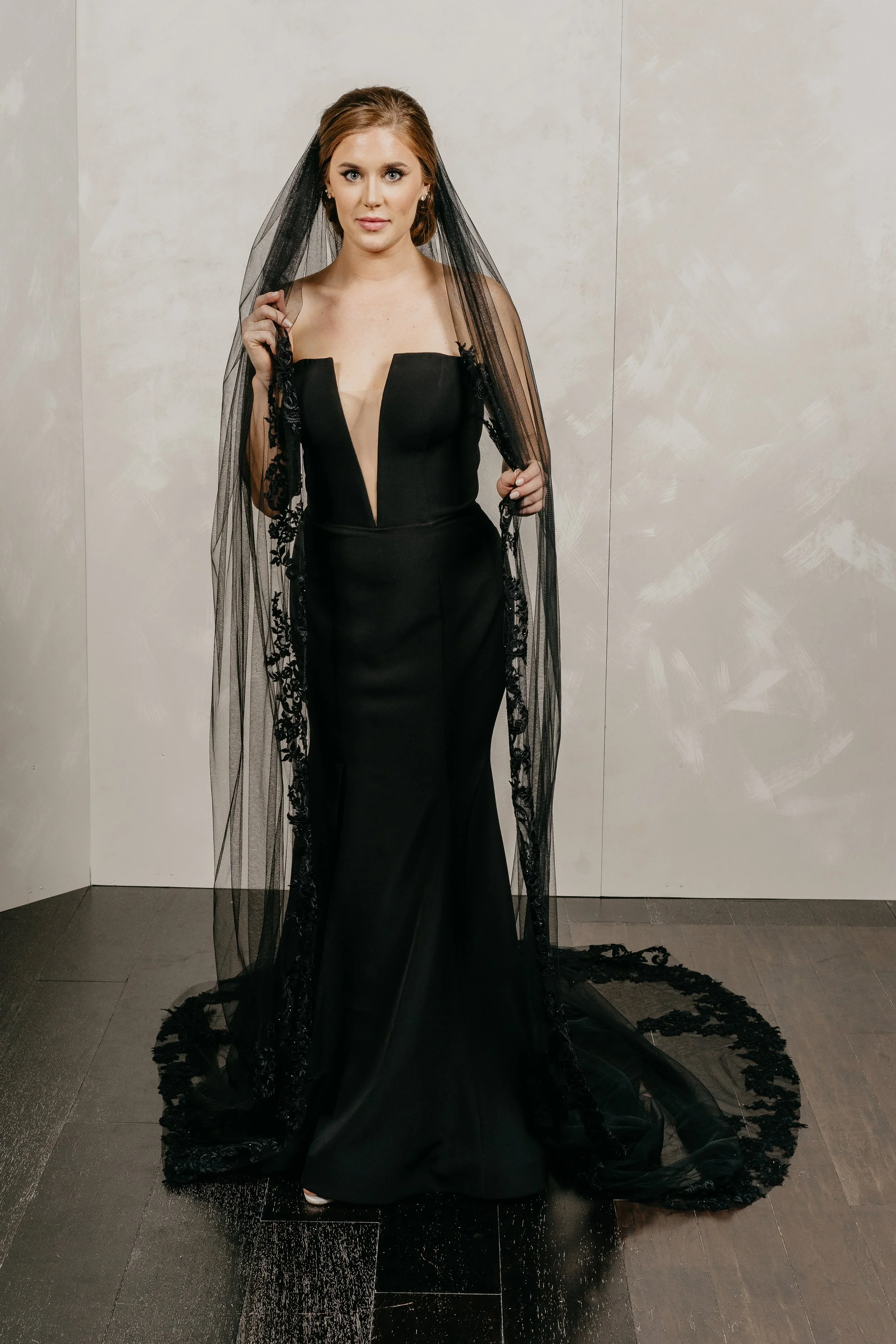 Elizabeth Lee Lanie classy black crepe fit-and-flare wedding dress with modern plunging neckline.