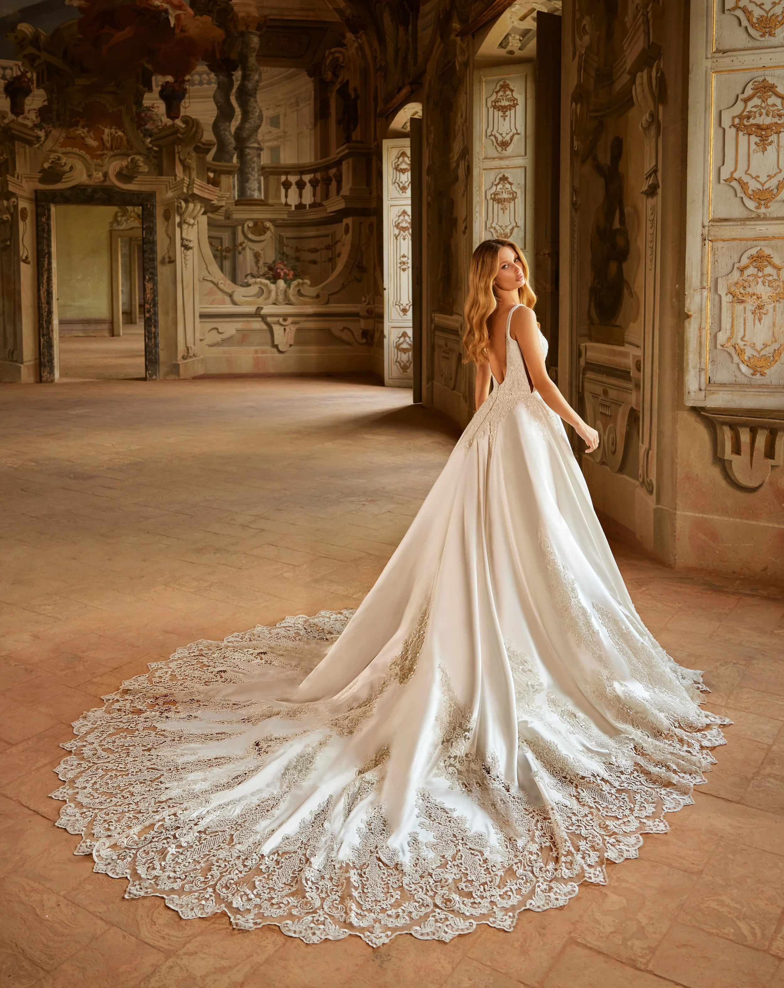 Madam Burcu Style 5016 ballgown wedding gown with square neckline, tank straps, beaded bodice, satin skirt, and lace appliqué cathedral train in ivory champagne