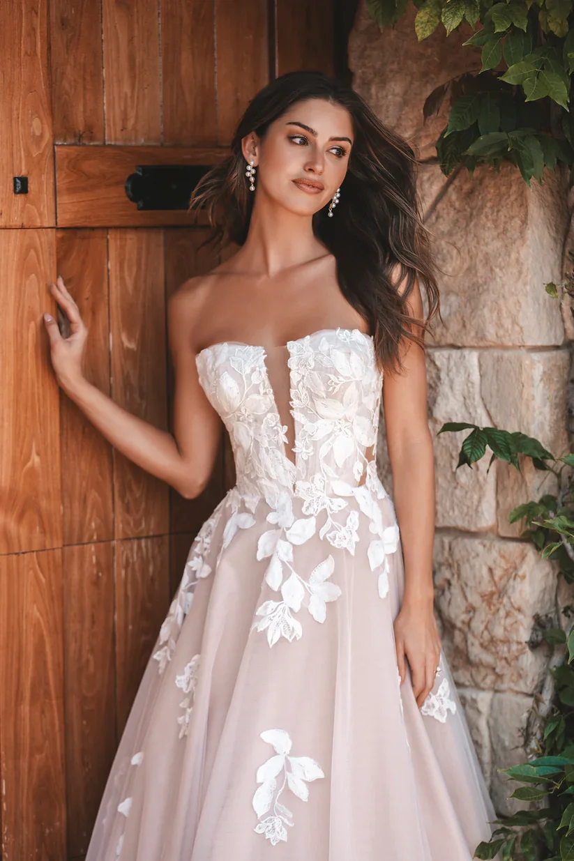 Allure Bridals A1208 strapless ballgown wedding dress with overblown leaf and bloom matte lace appliques over a traditional full tulle skirt.
