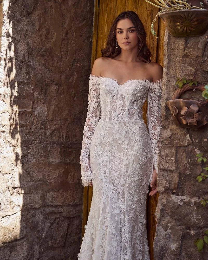 Calla Blanche Klara 125253 strapless or long-sleeve sheath wedding dress with sweetheart neckline, vintage 3D floral lace, sweeping train, and detachable off-the-shoulder sleeves.