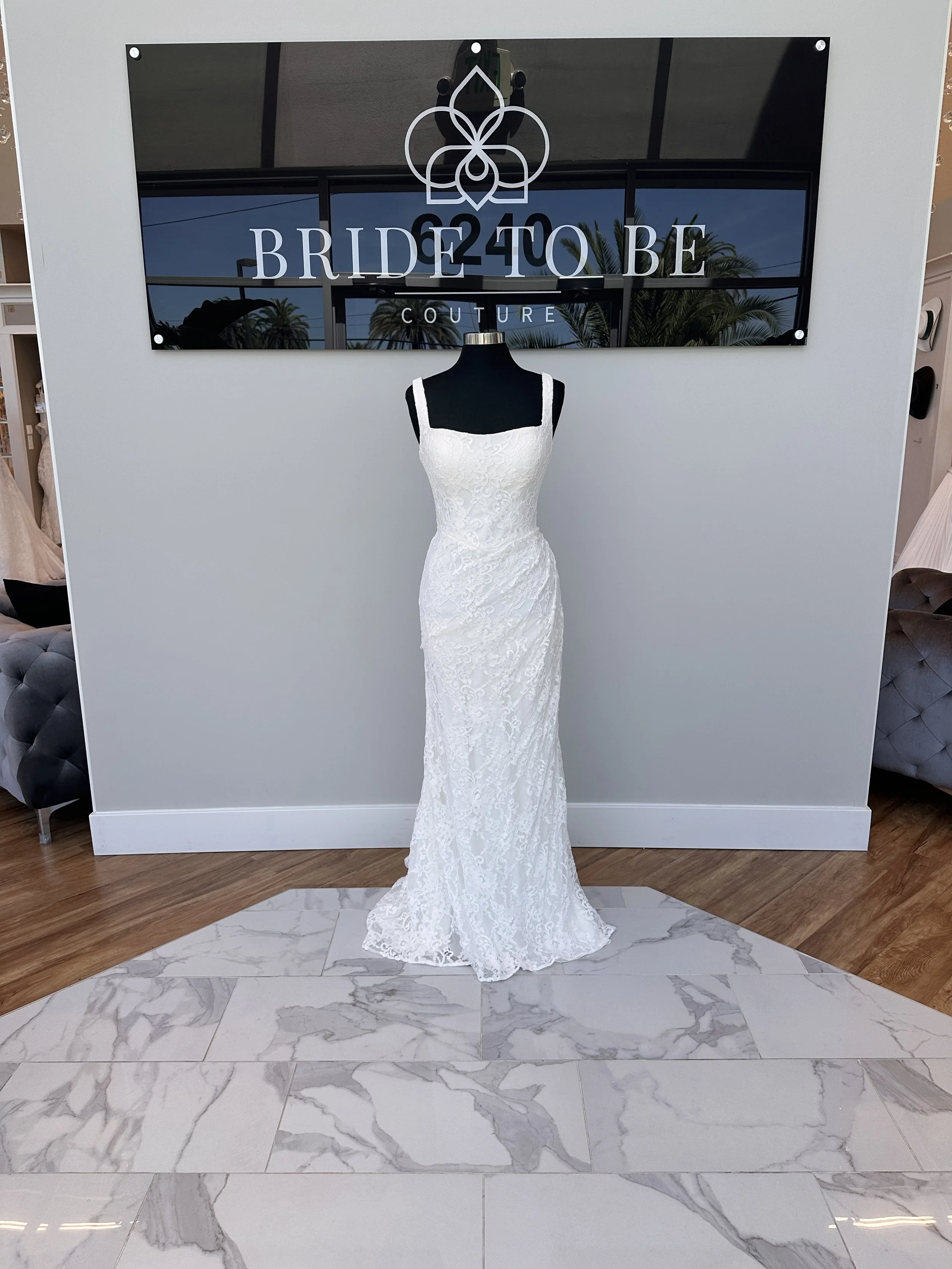 Legacy Jane lace fit-and-flare wedding dress with a square neckline at Bride To Be Couture Sacramento.