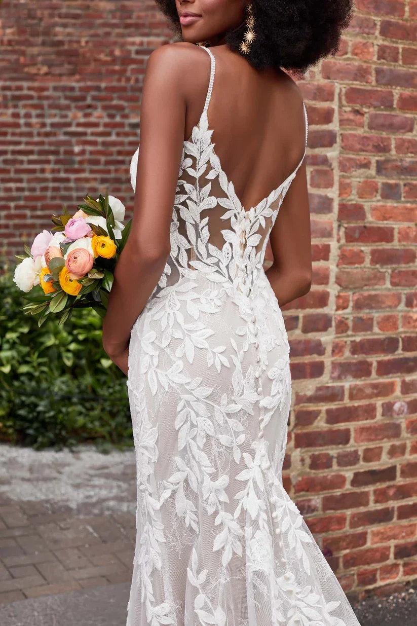 Madison James Jordan strappy lace sheath wedding dress with nature-inspired leaf and branch appliques across the bodice.