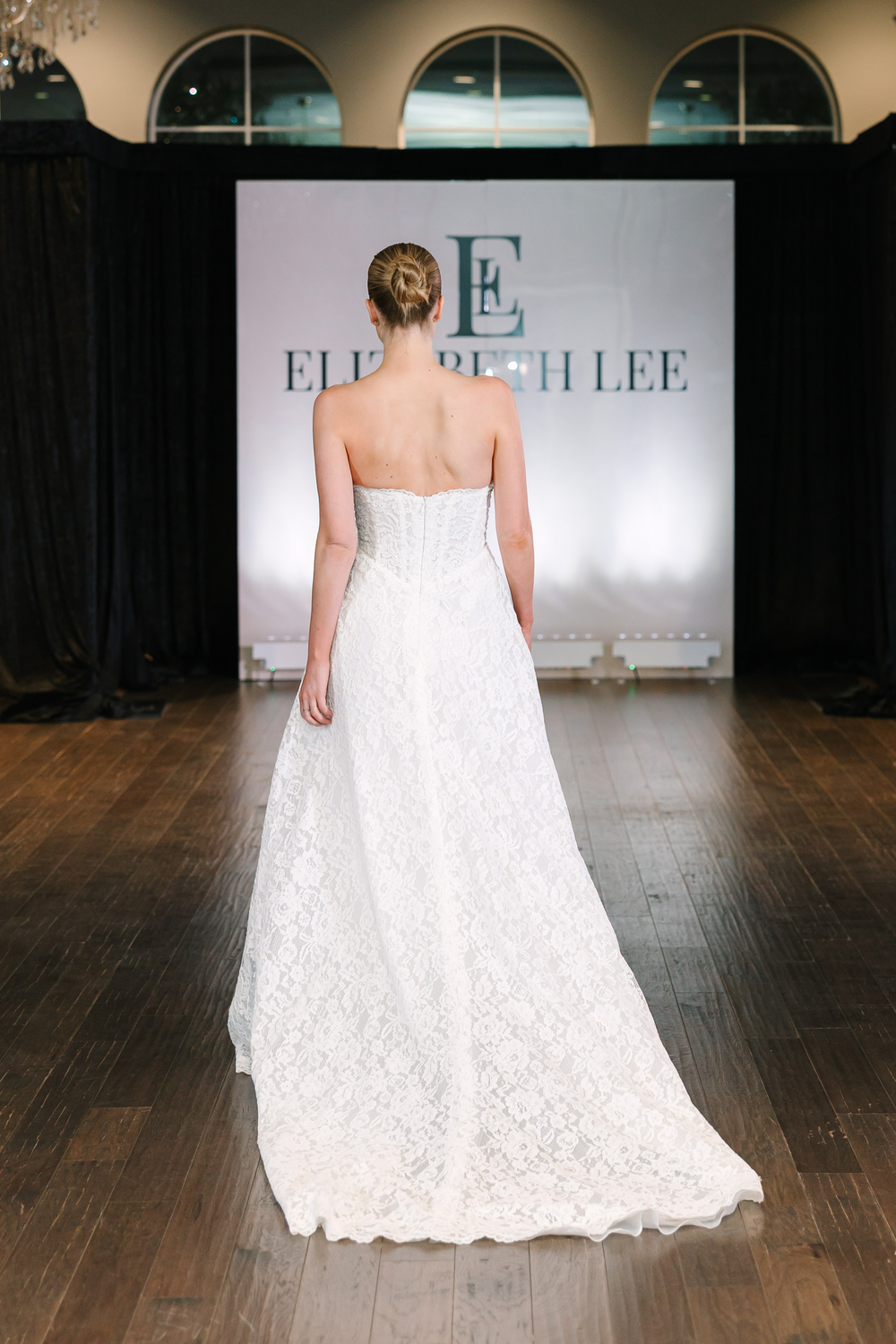 Elizabeth Lee Liliana soft A-line floral lace gown with a sweetheart neckline, basque waist, and beaded bodice, available at Bride To Be Couture in Sacramento.