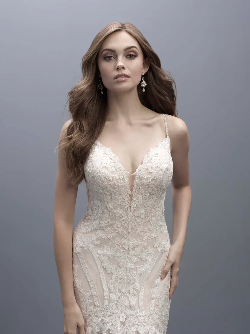 Madison James MJ704 subtly flared A-line wedding gown with symmetrical lace appliques on the bodice.