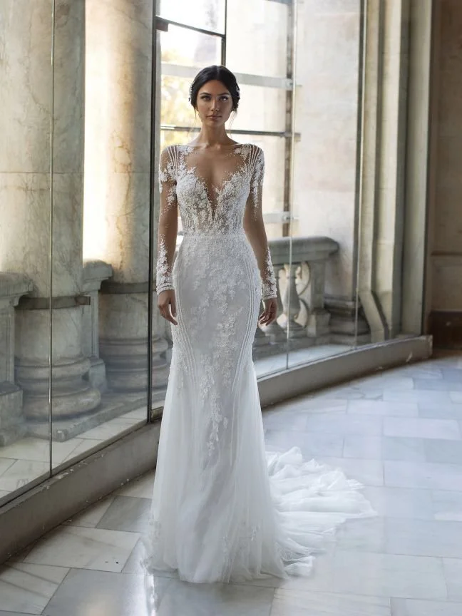 Pronovias Pickford lace mermaid wedding dress with long lace sleeves, V-neckline, beaded tattoo-effect back, and detachable bodice lining.