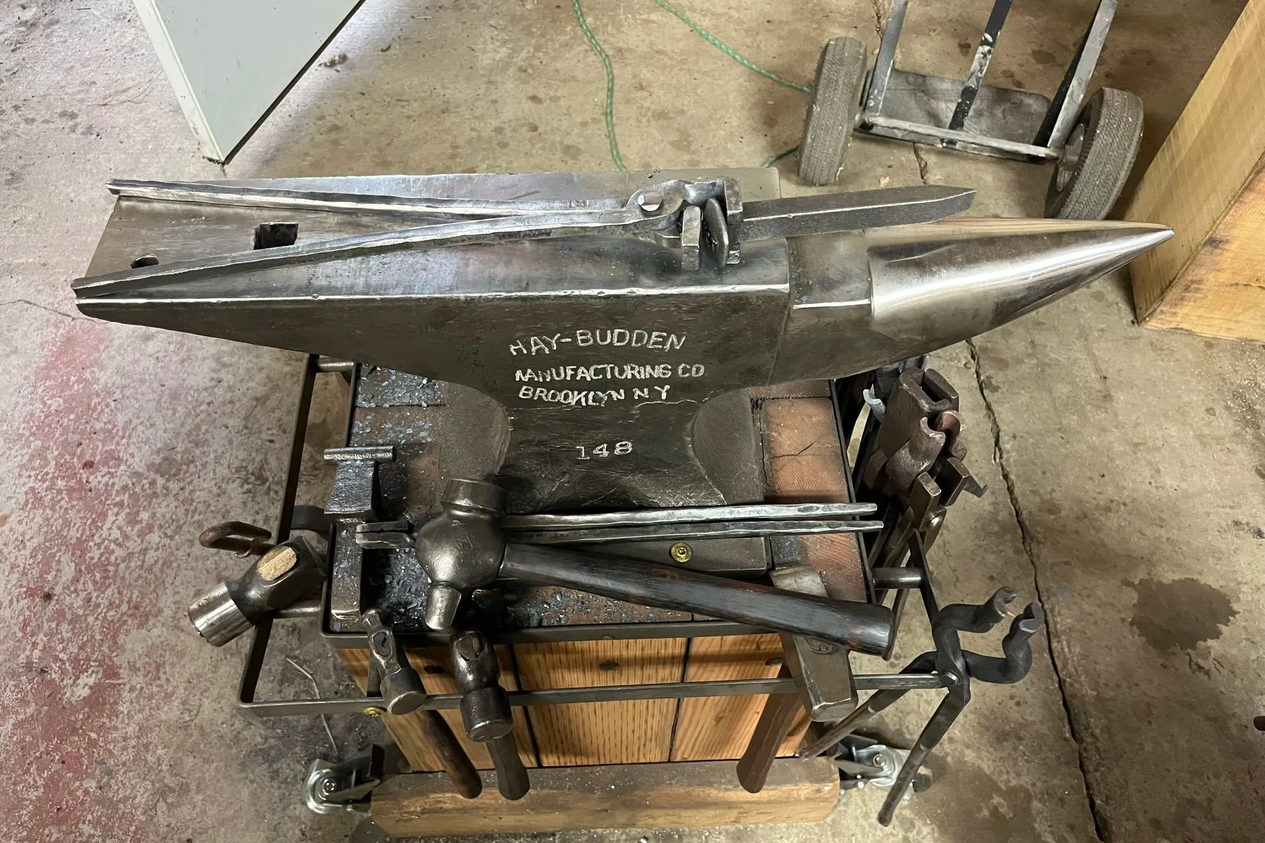 A set of forged tongs for Rail Road Spikes on a Hay-Budden Anvil in the Deadmoose Forge in Cambridge MN