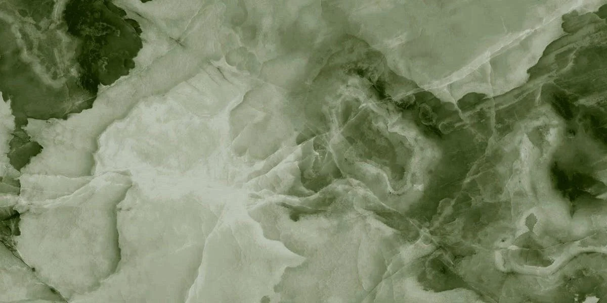 Close-up of green marble stone with white and dark green veins.