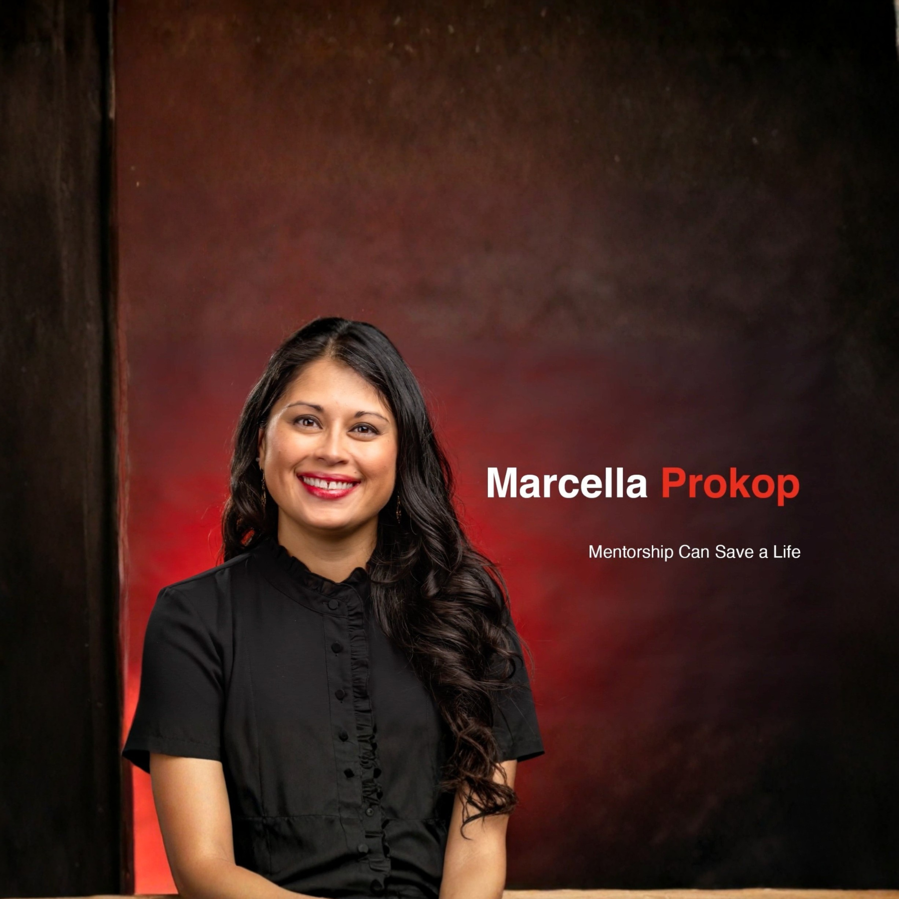 A woman with tan skin and long, black hair smiles at the camera.