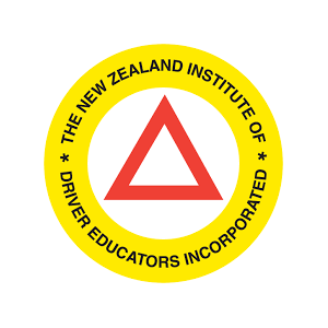 Logo of the New Zealand Institute of Driver Educators, featuring a red triangle inside a yellow circular border with black text.