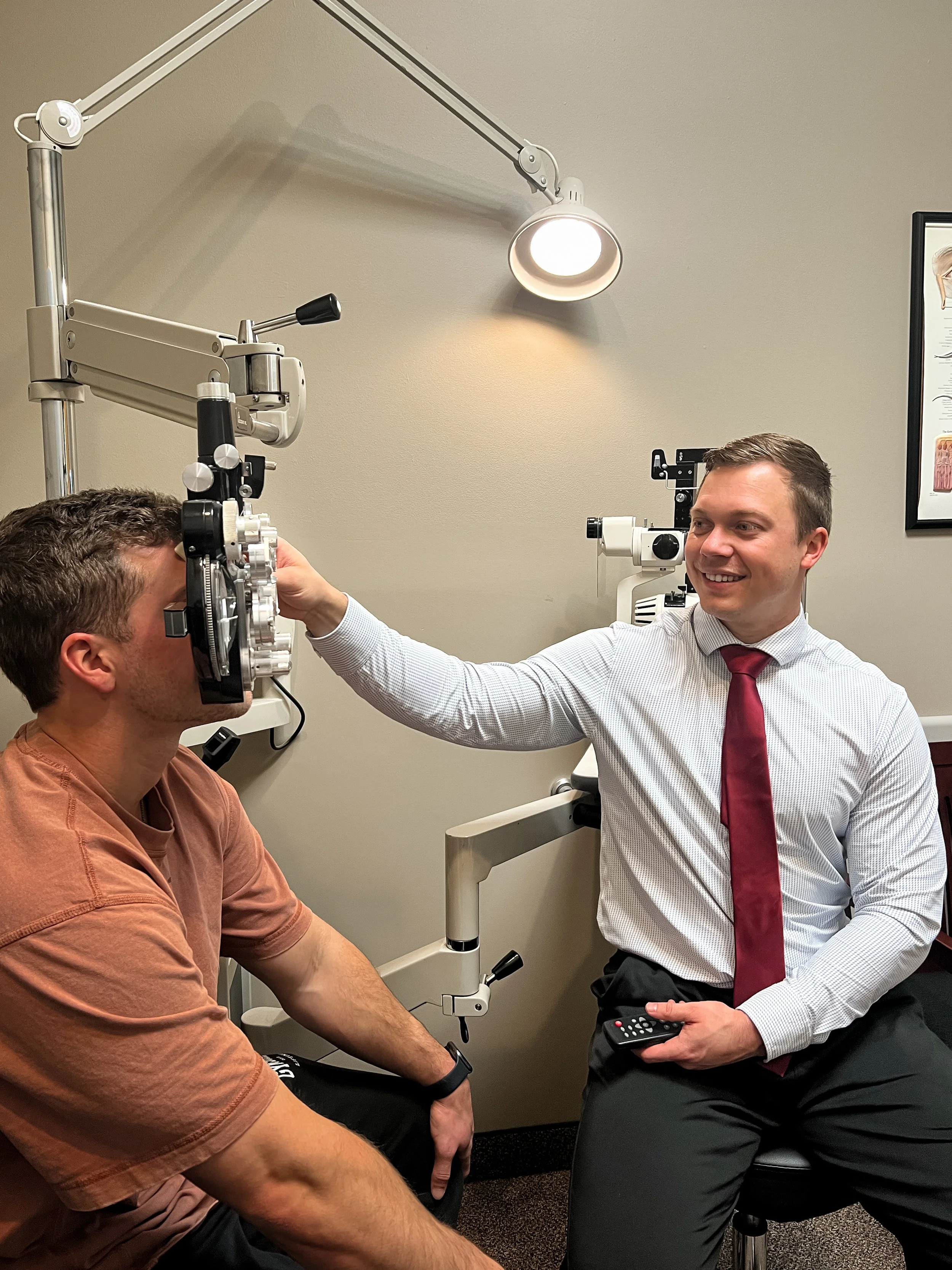 Dr. Daniel Kenner performing a comprehensive eye exam on a patient at Apex Vision Group