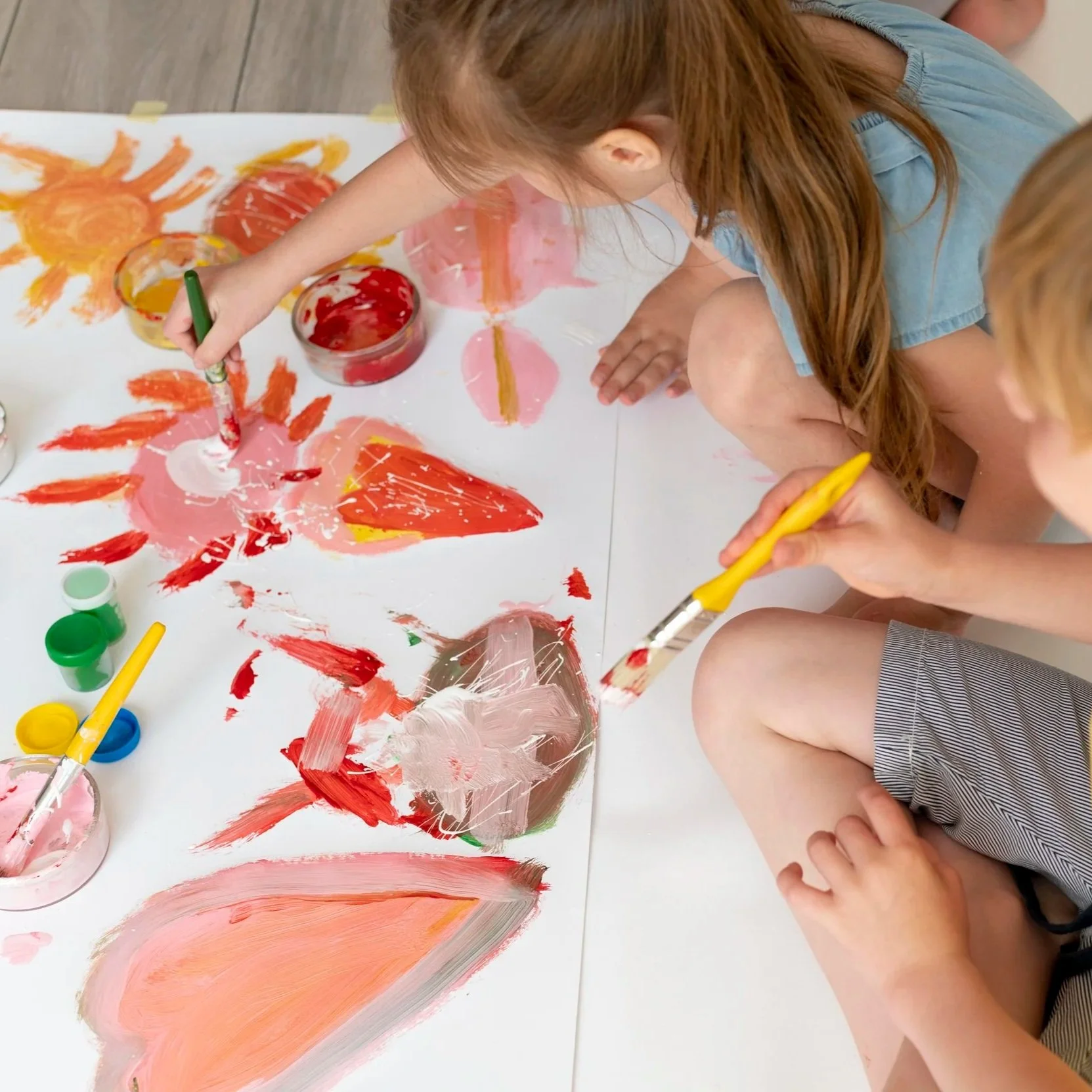 boy-girl-painting-together-close-up.jpg (Copy)