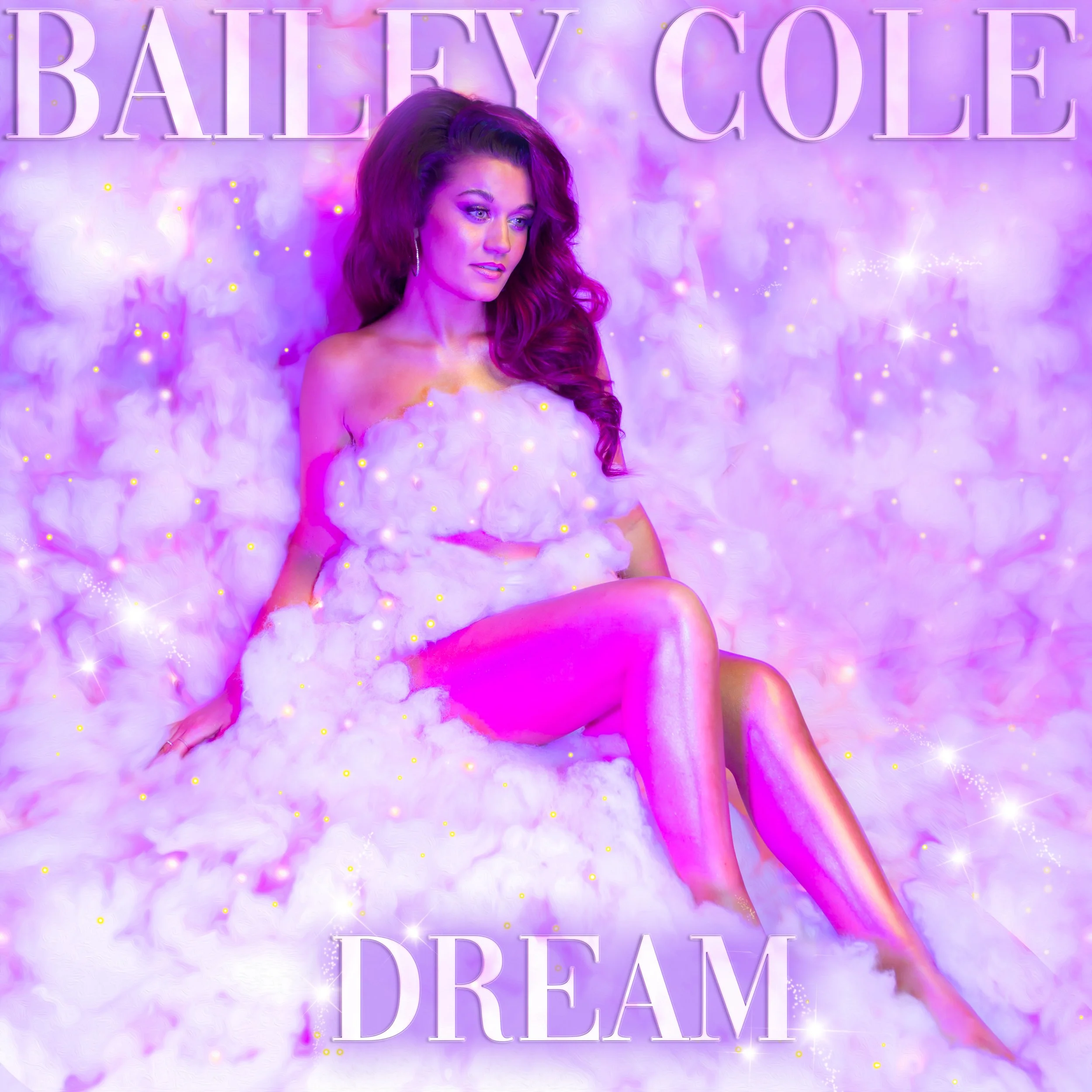 A woman sitting on a fluffy pink and white cloud bed with a mystical, dreamlike background filled with soft pastel colors and sparkles. Text at the top reads 'Bailey Cole' and at the bottom 'Dream', suggesting a fantasy or dreamy theme.