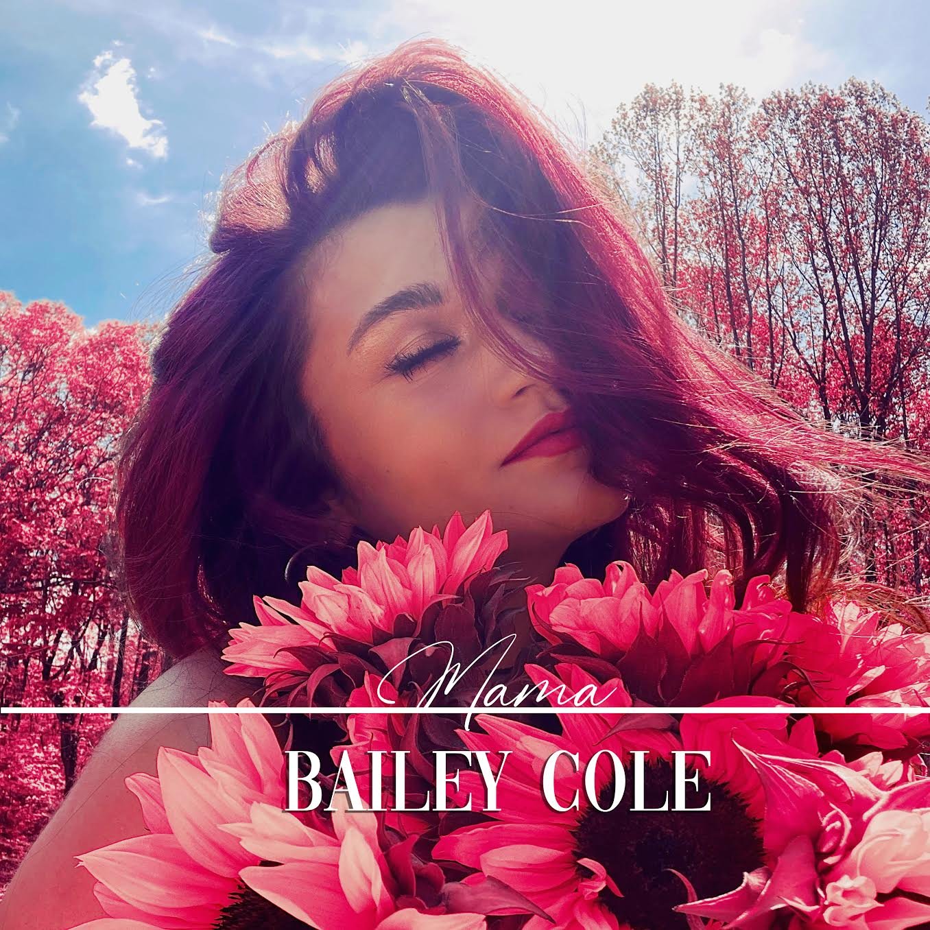 A woman with red hair holding a bouquet of pink flowers outdoors with pink flowering trees and a blue sky in the background. Text over the image reads 'Mama Bailey Cole'.