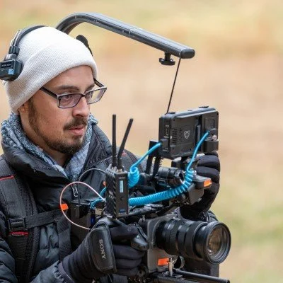Image of Will Dickinson holding a sony FX6 wearing an easy rig