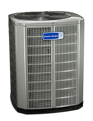 An American Standard central air conditioning unit with a large, rectangular, metal grille and a fan on top.