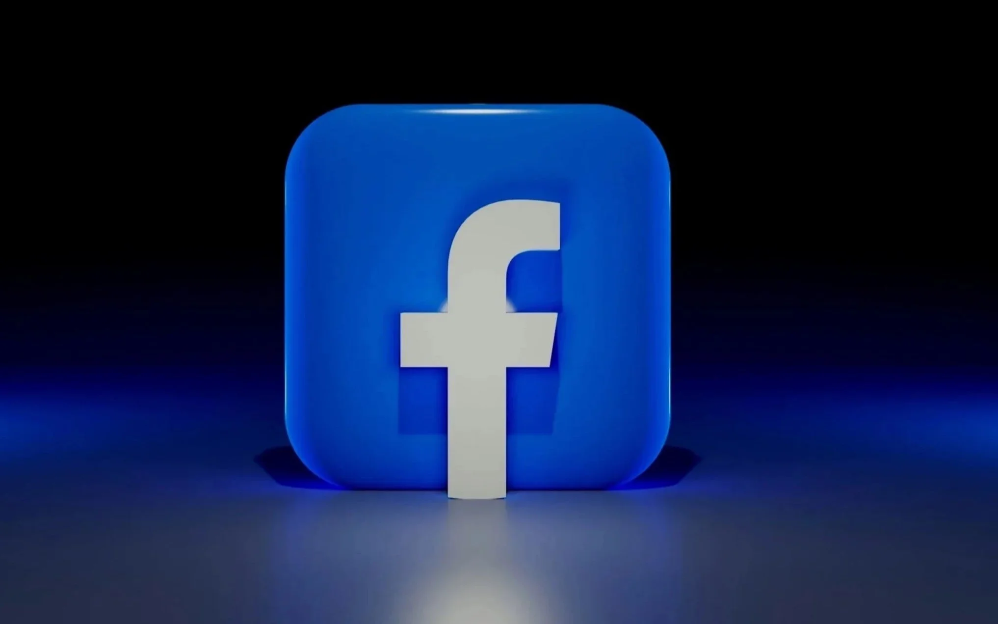 Facebook logo in blue and white against a dark background.