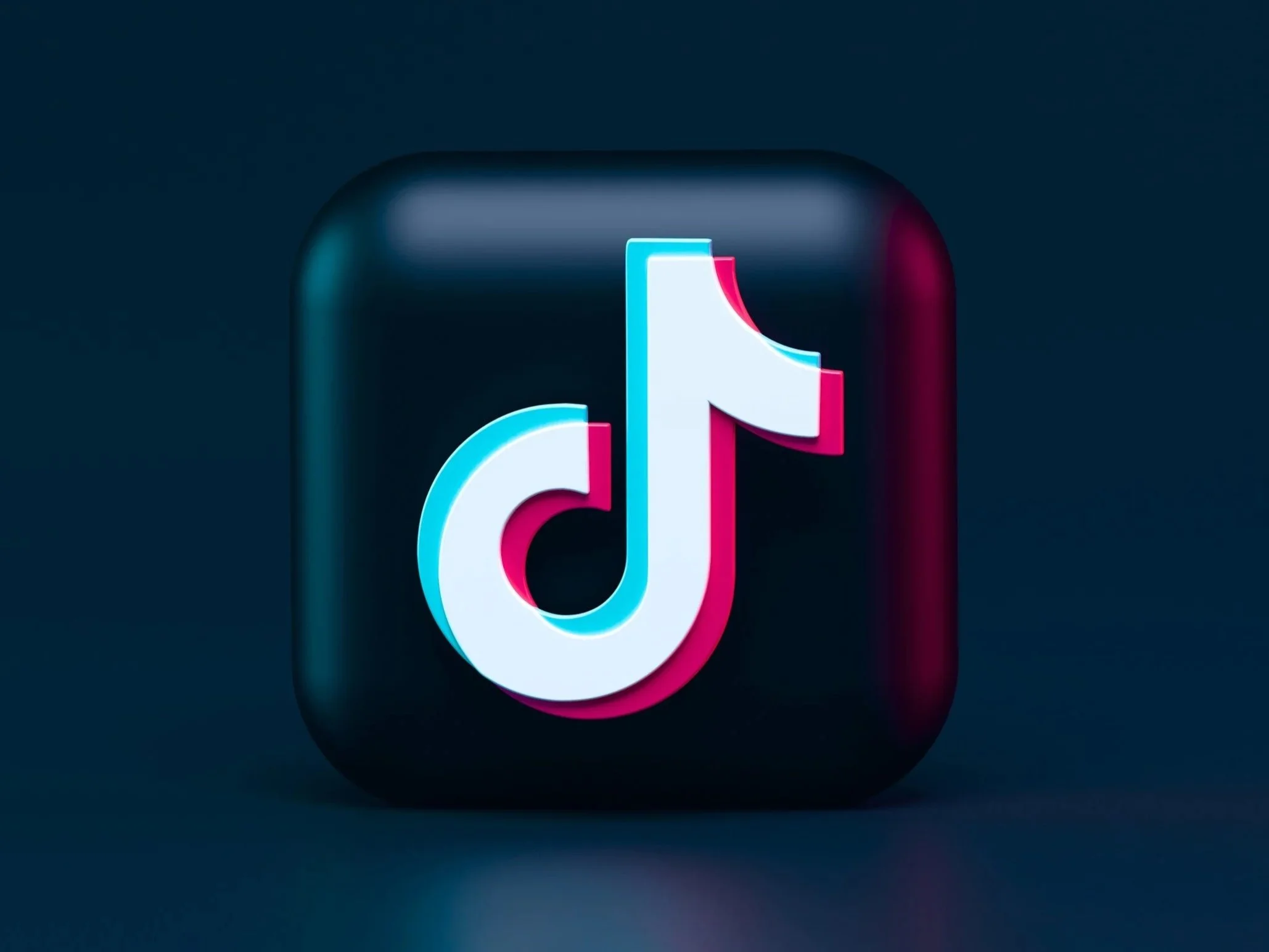 TikTok app icon on a dark background.