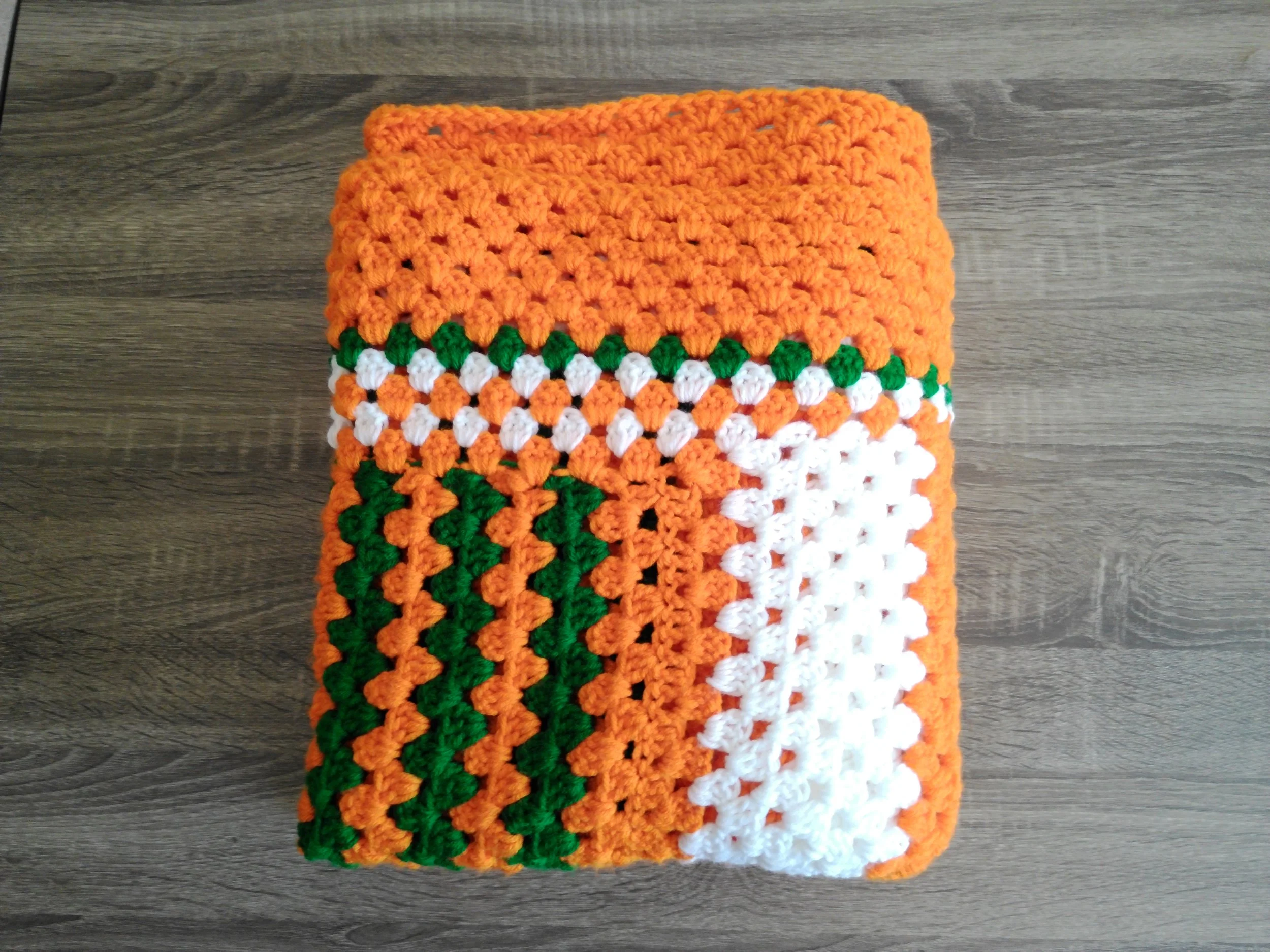 Orange Green and White Blanket Folded Top.JPG