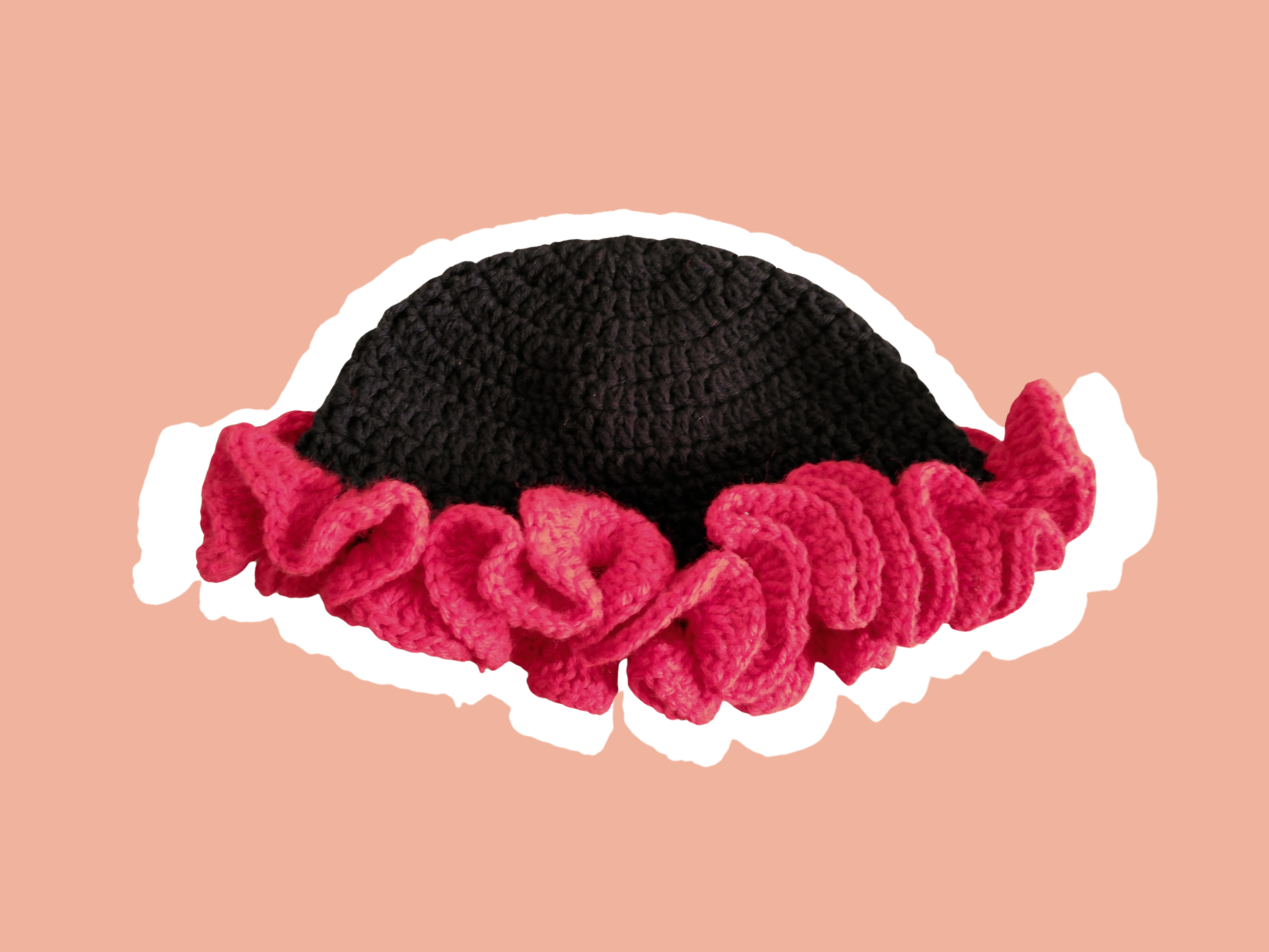 Black and Cherry Red Crochet Ruffle Bucket Hat on a muted orange background with a white outline