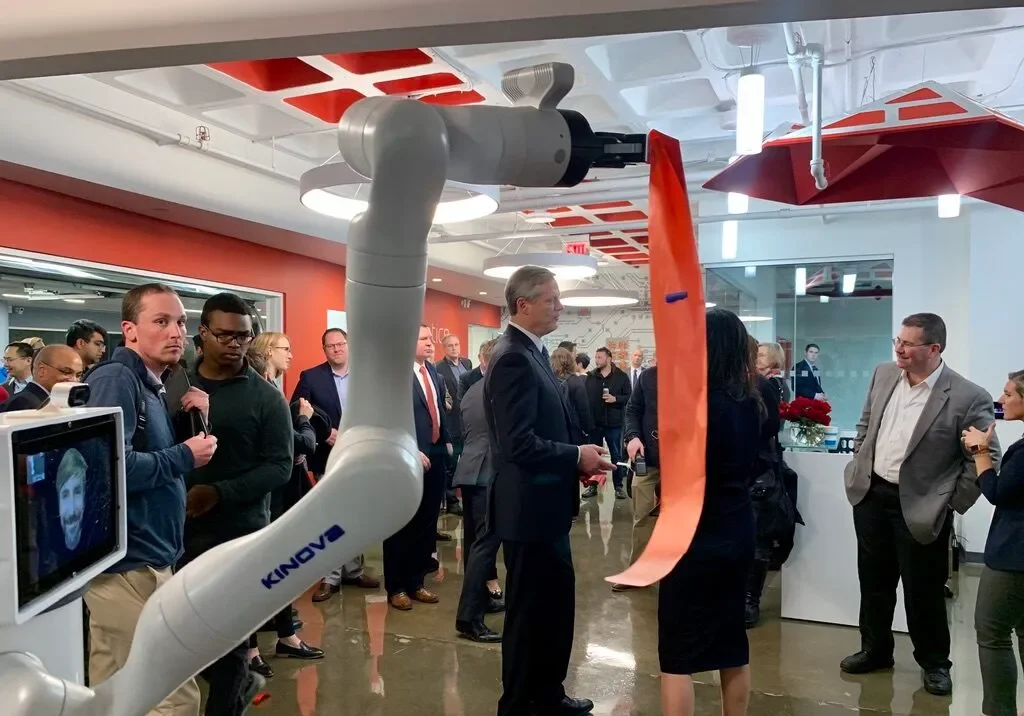 09_MR_Robot-ribbon-cutting-e1636234902340.webp