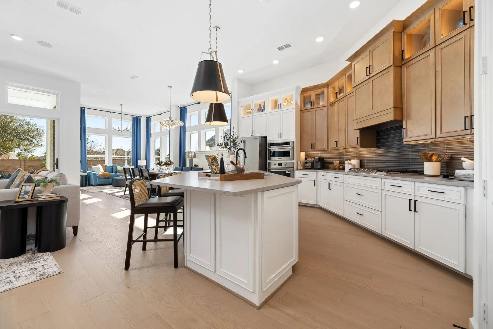 manvel-tx-massive-new-construction-open-concept-modern-kitchen-living-room-natural-light-interior-photography.jpg