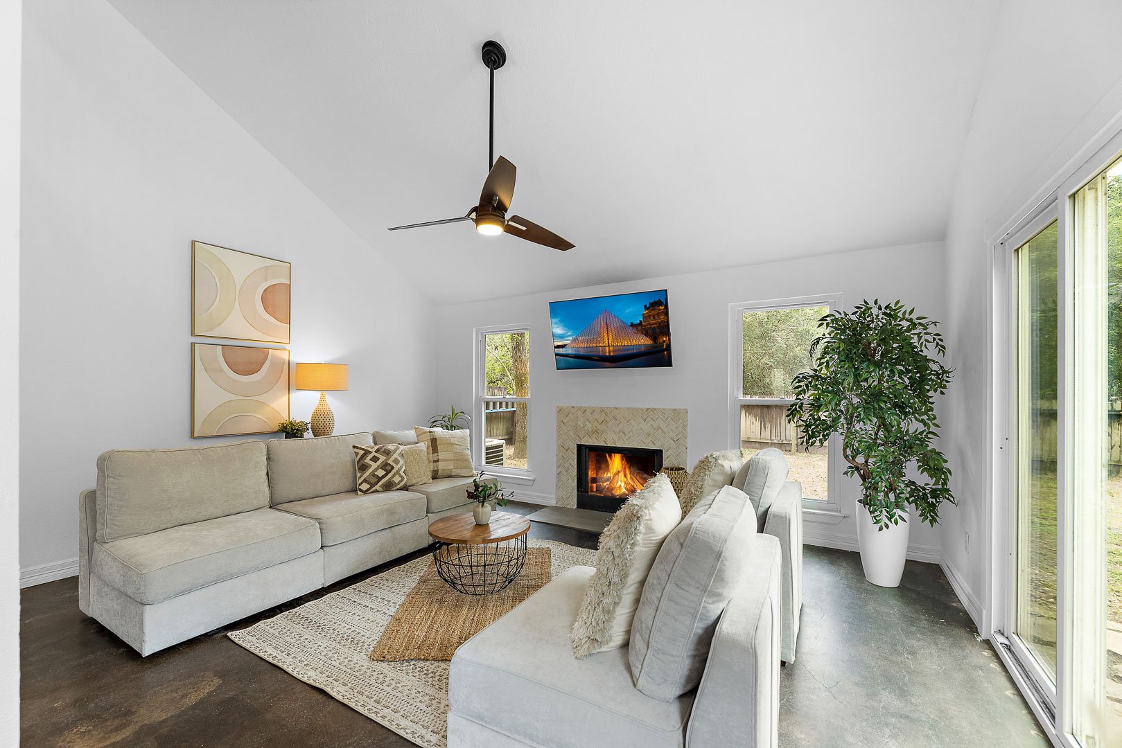 the-woodlands-common-area-living-room-fireplace-high-vaulted-ceilings-home-for-sale.jpg