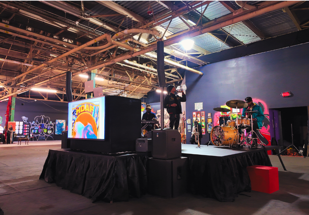 We enhanced the entertainment element of an art fair, by strategically placing a stage in the center of the room, with our DJ Booth w/ 65" TV display, and sound system.
