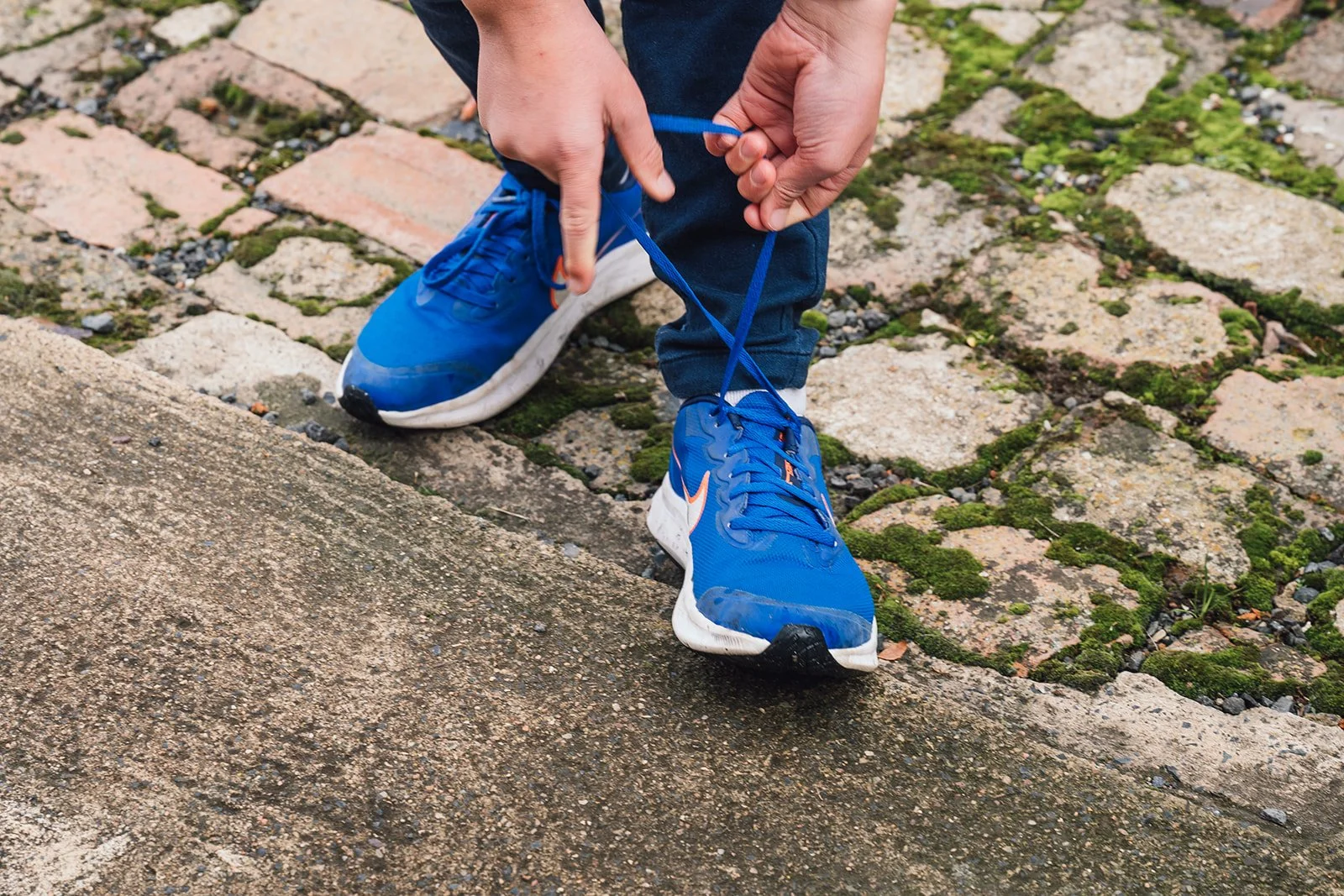 photo of occupational therapy for young adult - tying shoe laces - Total Health Orange