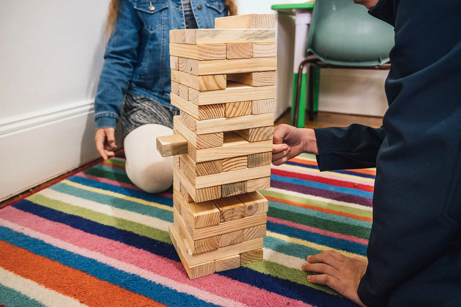 Hands-on play activity with Jenga game to support fine motor development.jpg